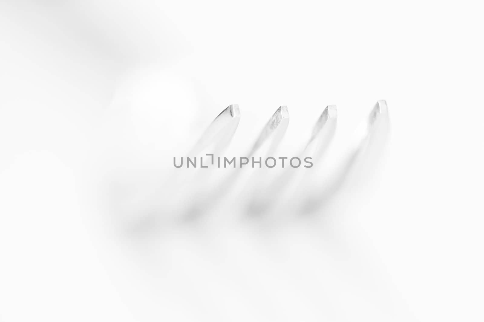 The fork on the white background, shallow shallow depth of field by MartMartov