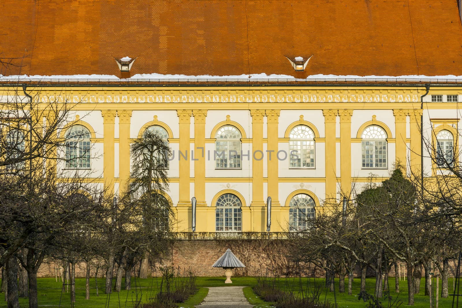 Historic building with trees in the foreground