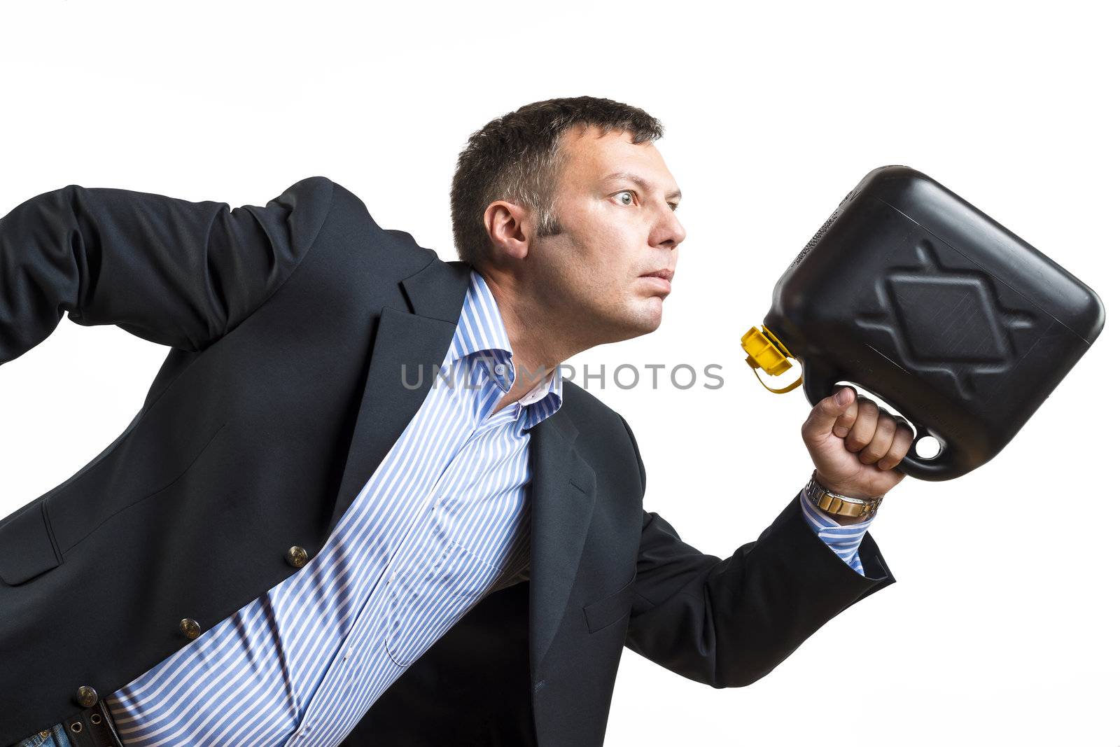 A man in business clothes with a gas can is hasty running to get fuel