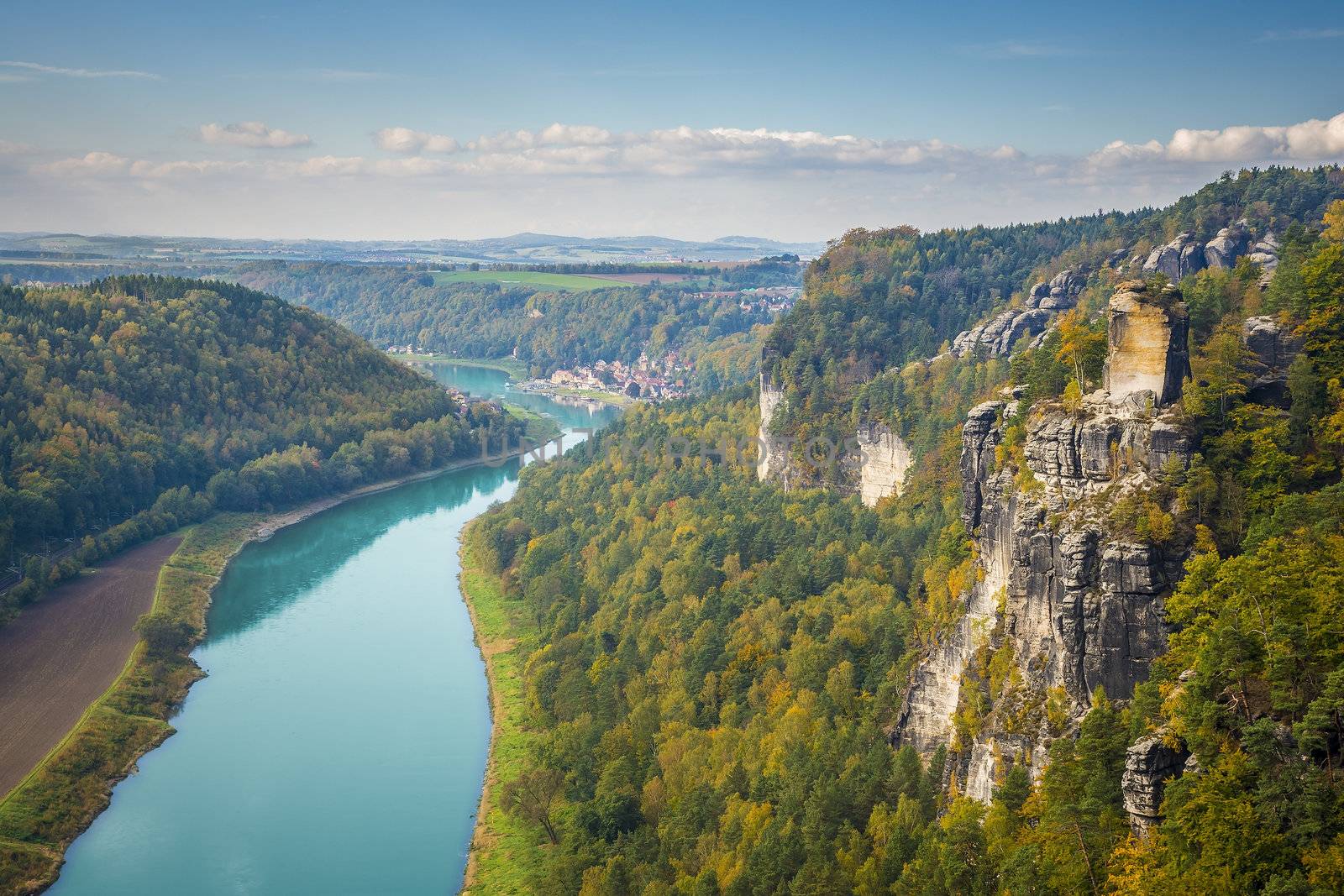 View from viewpoint of Bastei in Saxon Switzerland Germany to the town Wehlen and the river Elbe on a sunny day in autumn