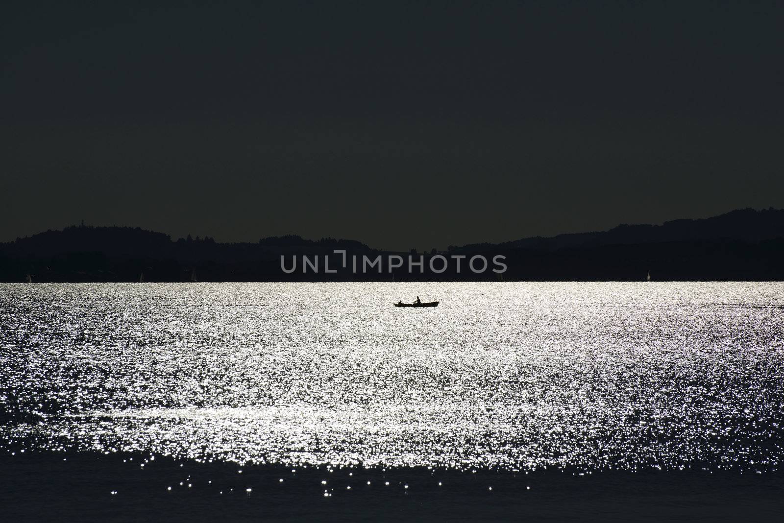 Eveningmood at Chiemsee with small boat