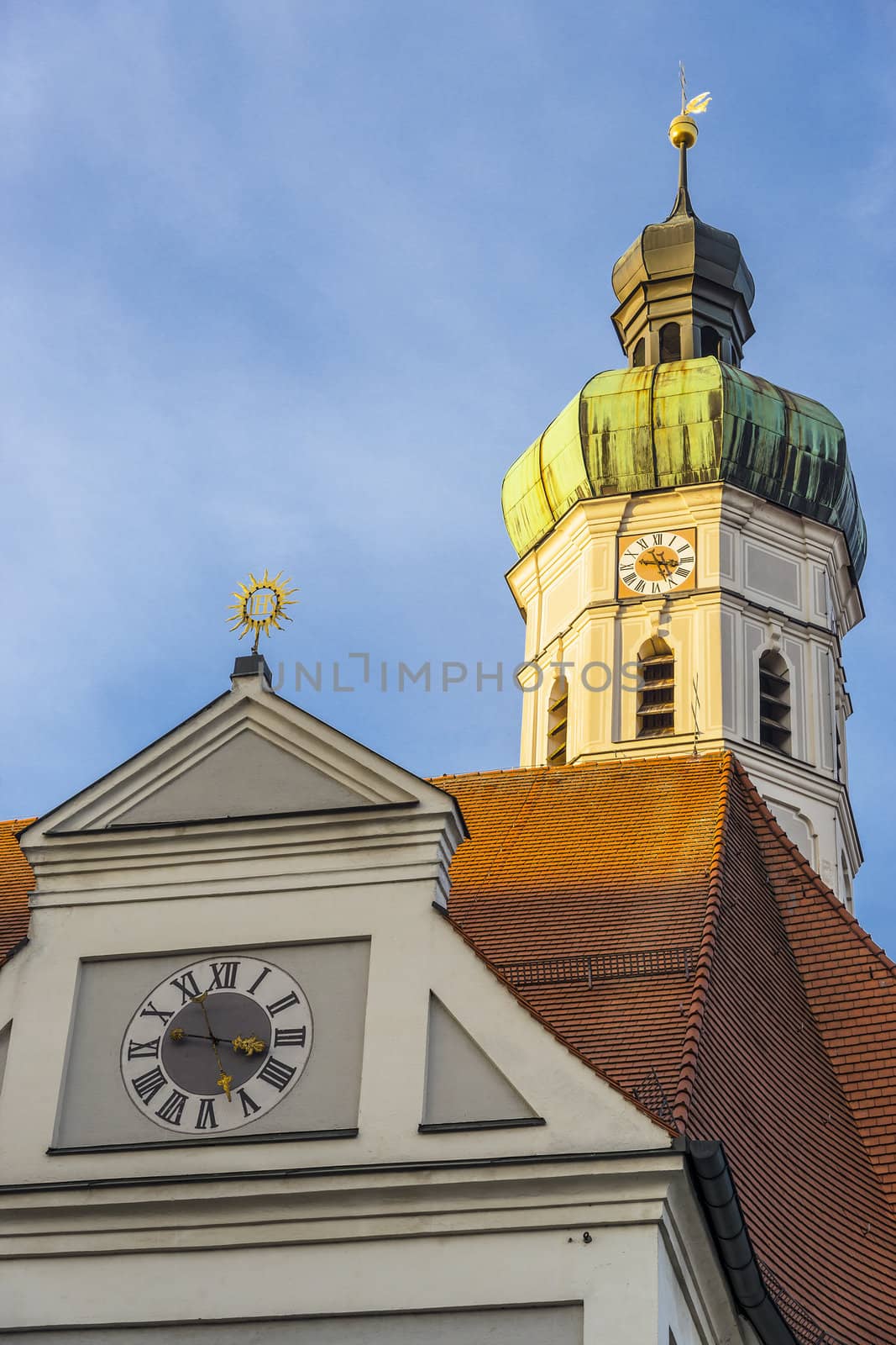 Steeple of the church in the town of Dachau in Germany with evening sun