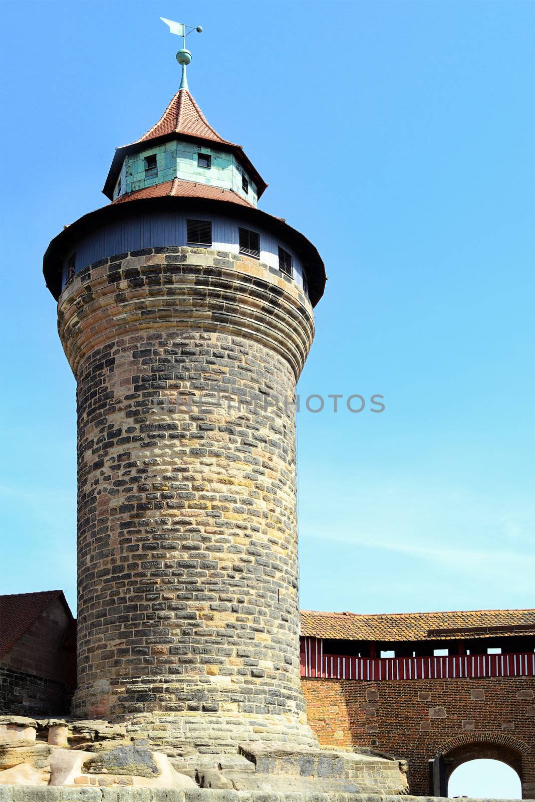 Tower of Nuremberg Castle with guard's walkway and portal on a summer day