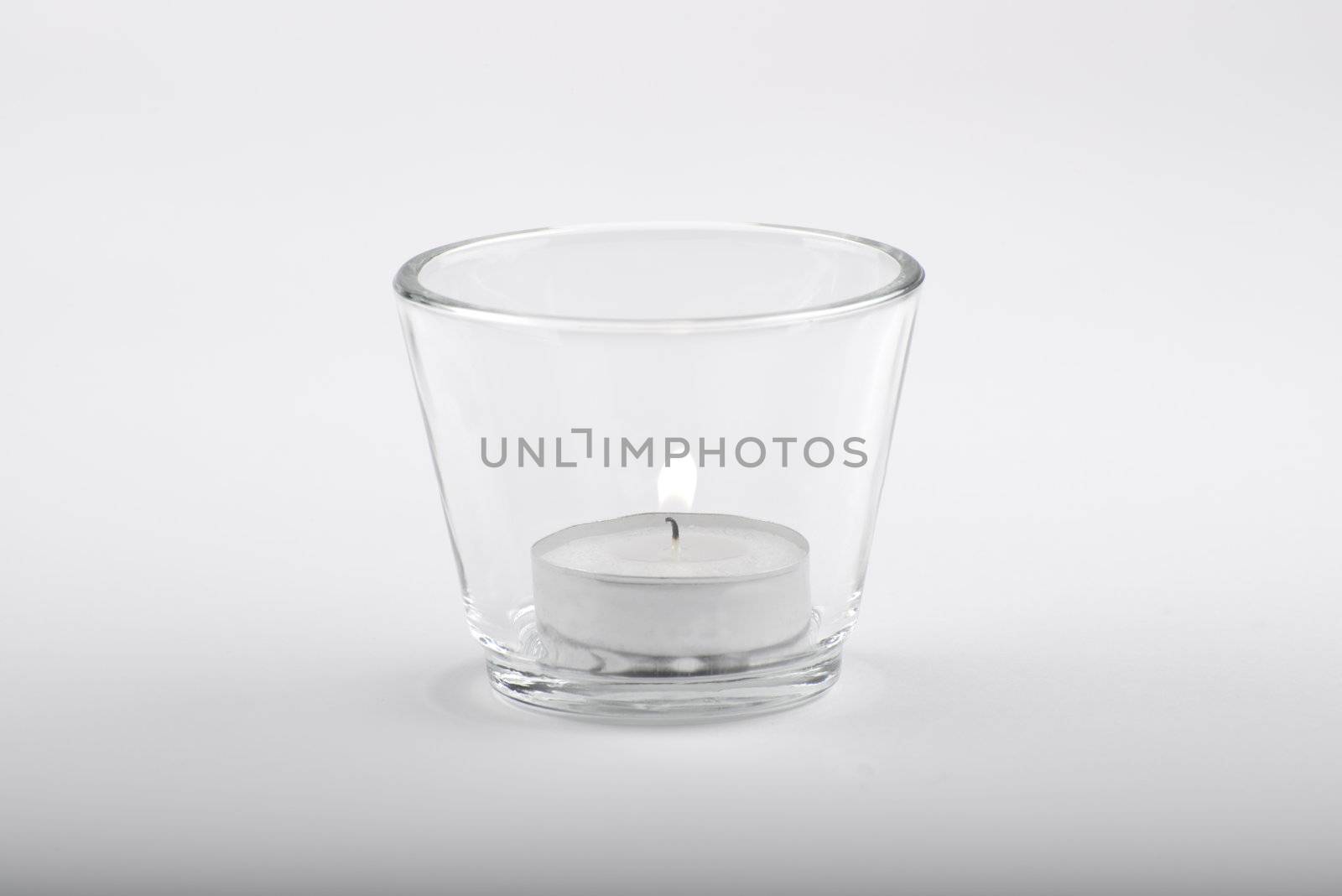 candle in glas with white background