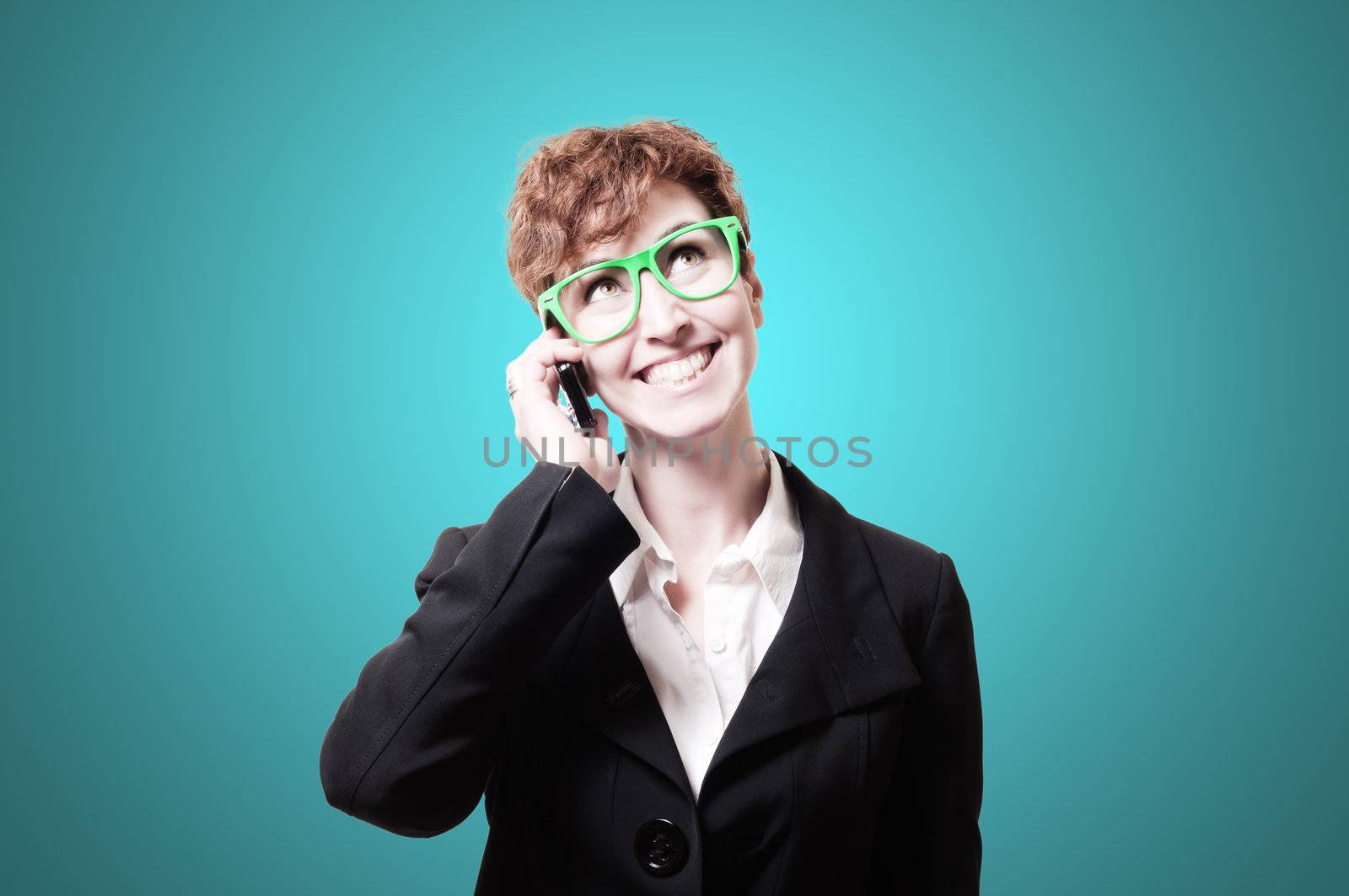 smiling business woman with phone on blue background