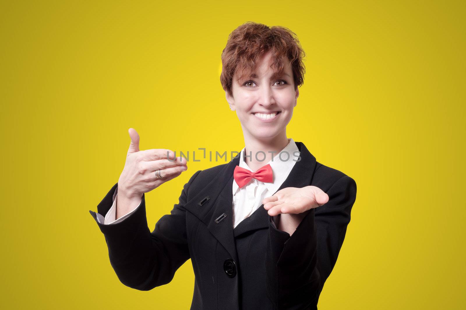elegant businesswoman with bow tie showing on yellow background