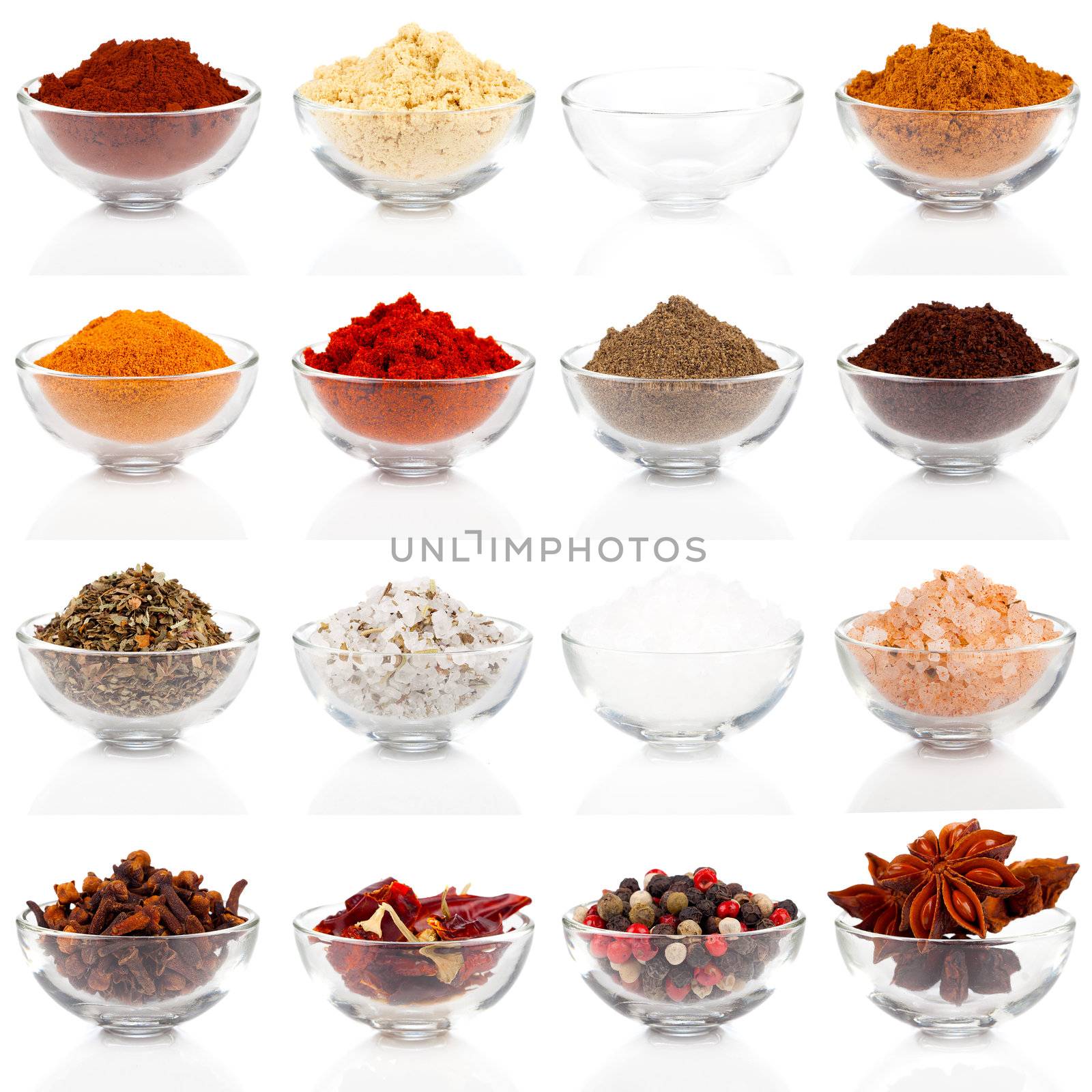 Variety of different spices in glass bowls for seasoning, isolated on white background