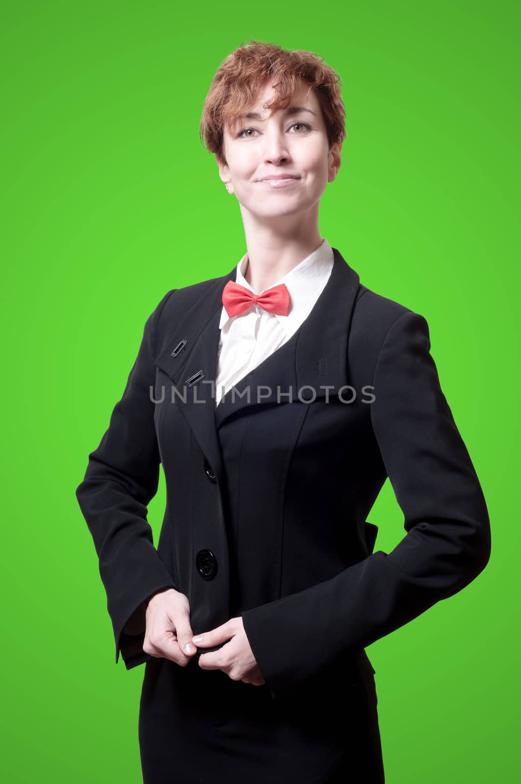 elegant businesswoman with bow tie on green background