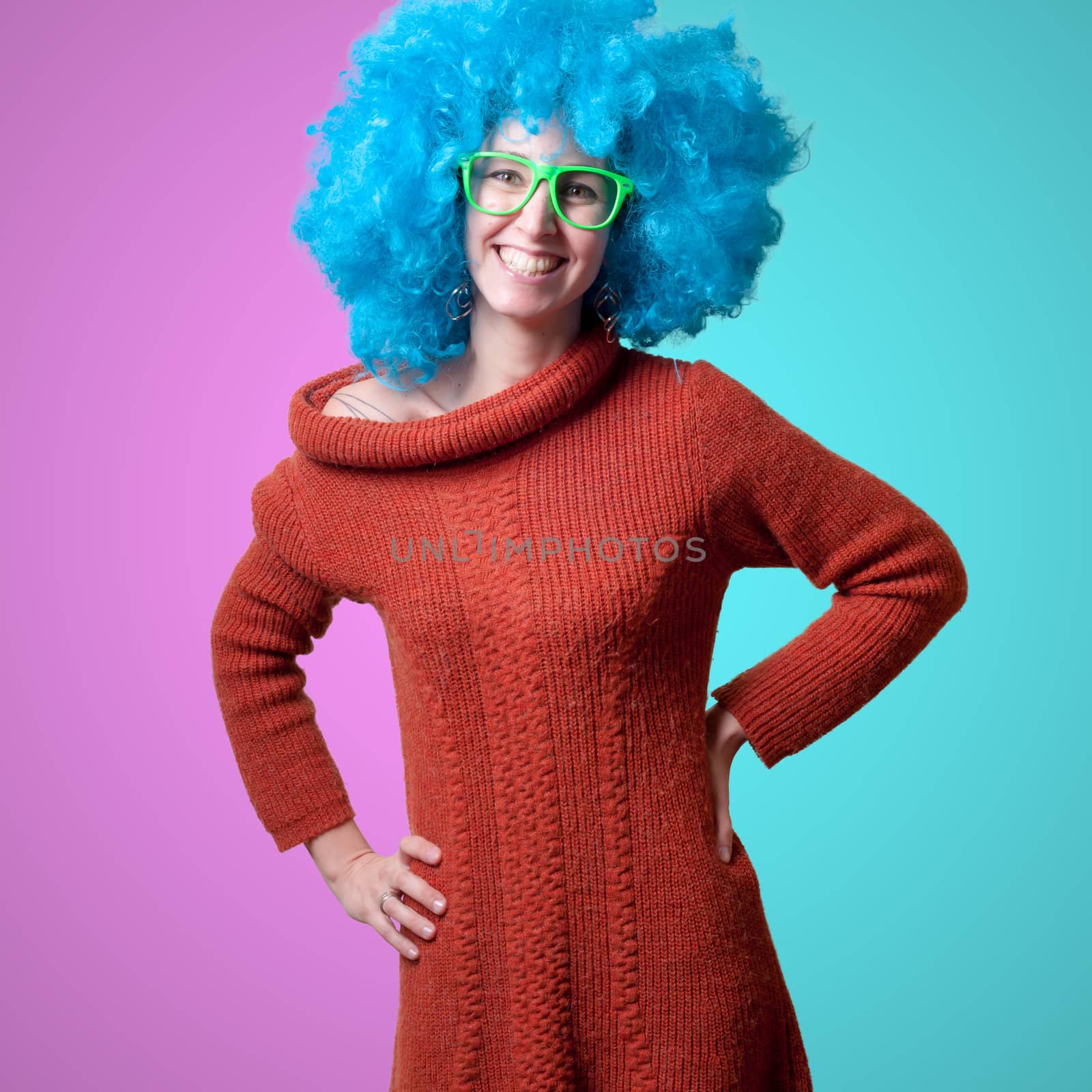 beautiful girl with curly blue wig and turtleneck on white background