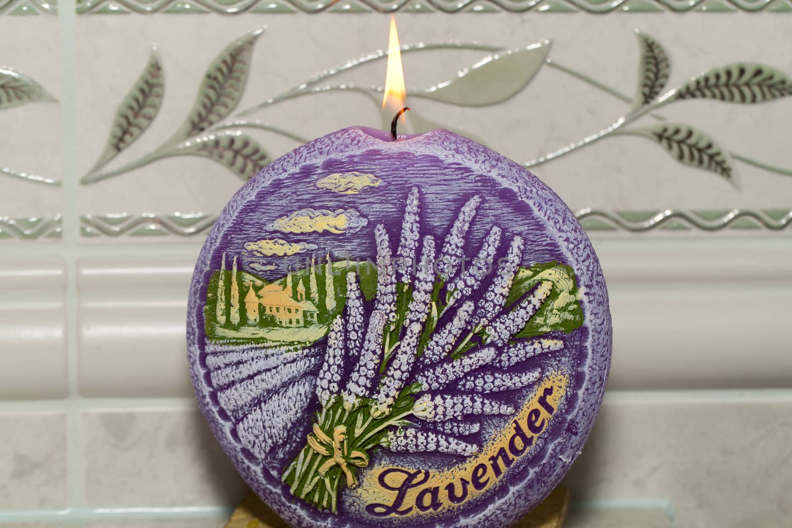 Candle with lavender flowers. Aromatherapy concept 