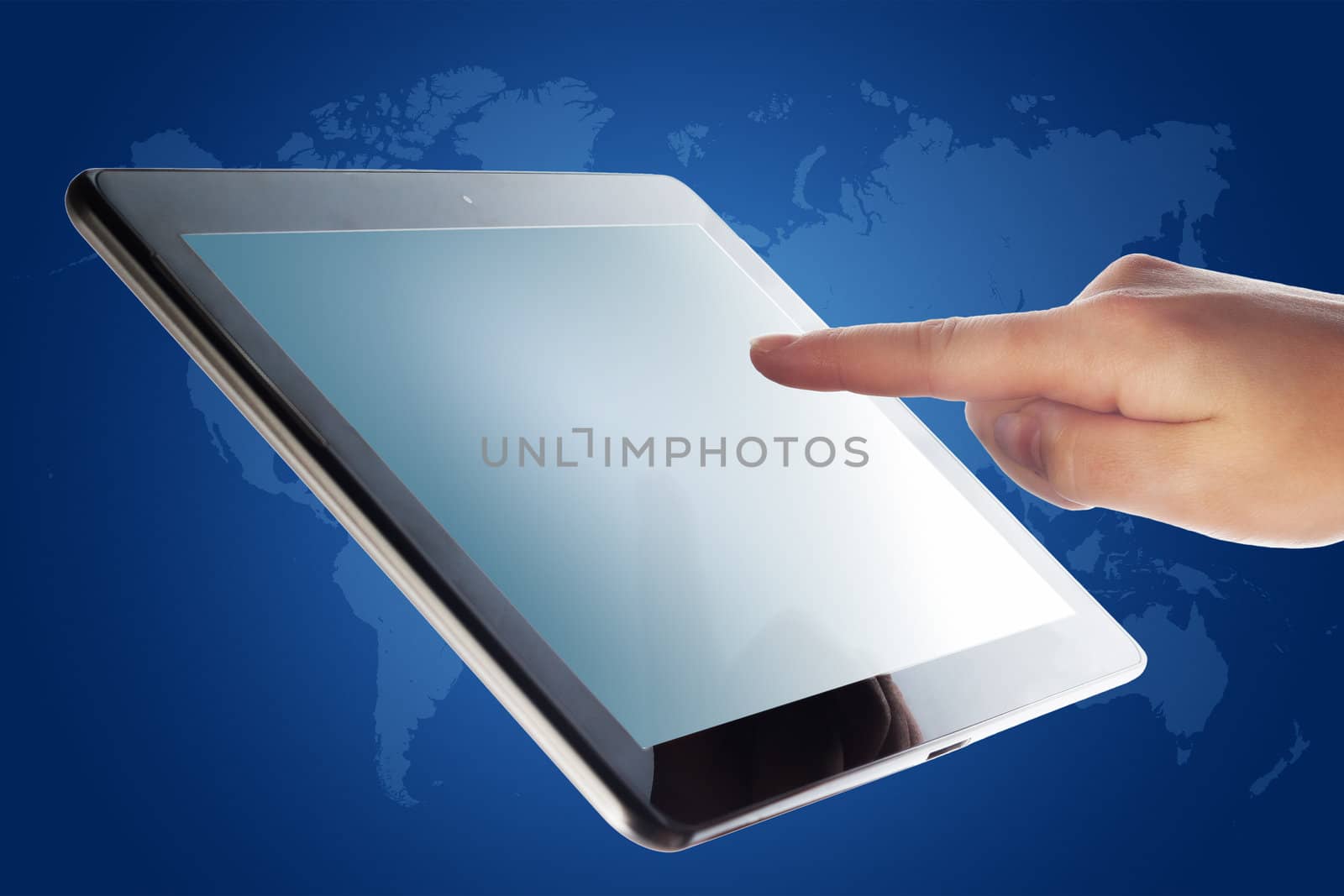 tablet computer and a hand on blue background with world map