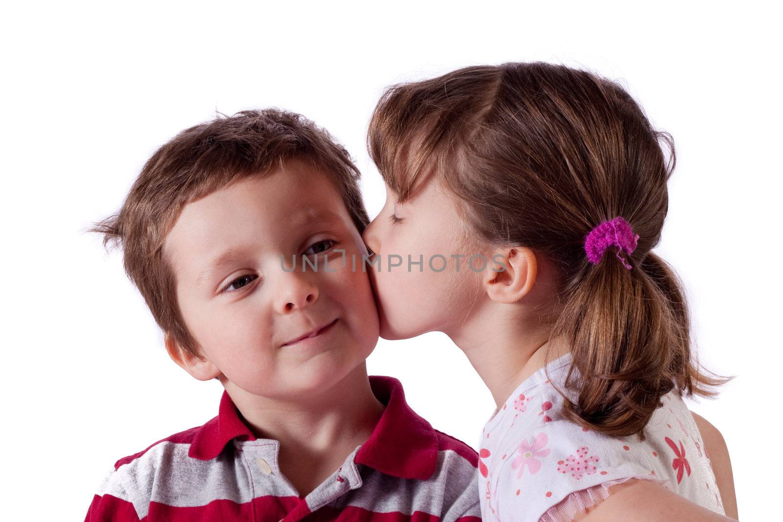 Cute little girl kissing a boy