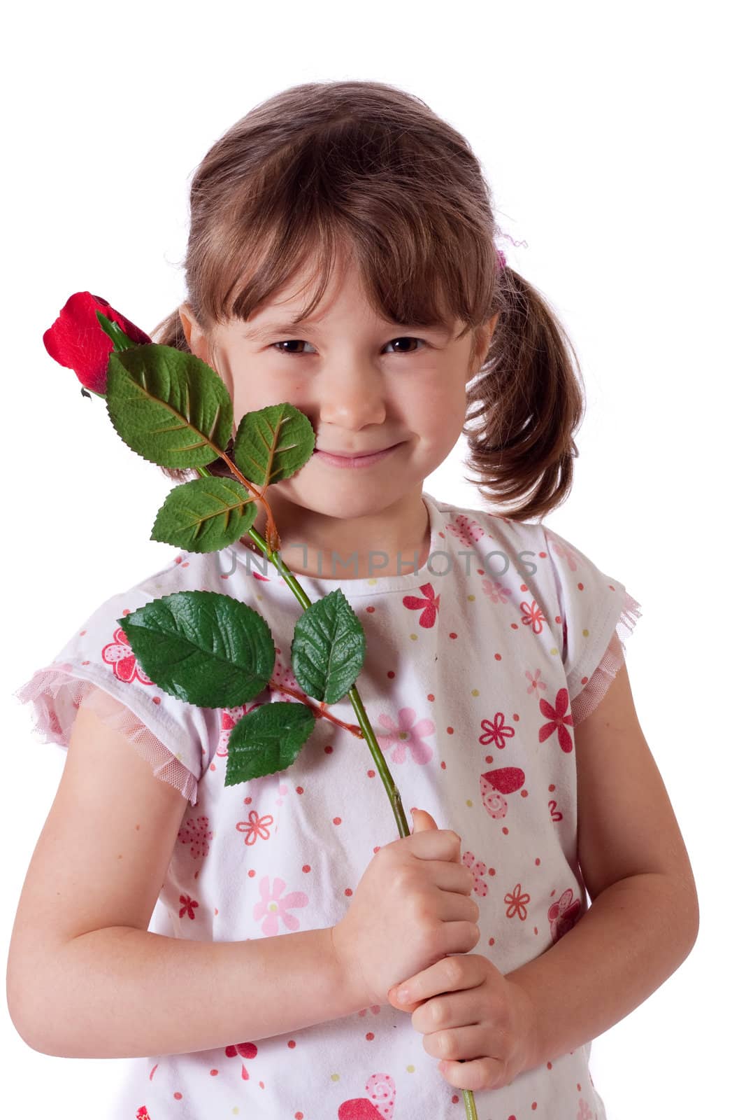 Cute little girl holding a red rose