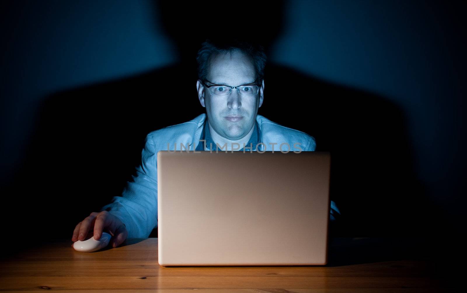 Man working late in front of his computer