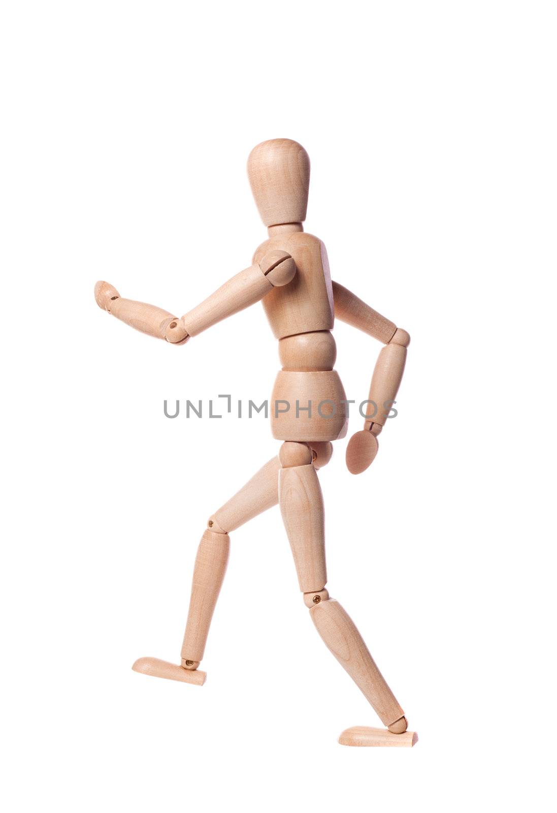 Wooden puppet in a jogging position