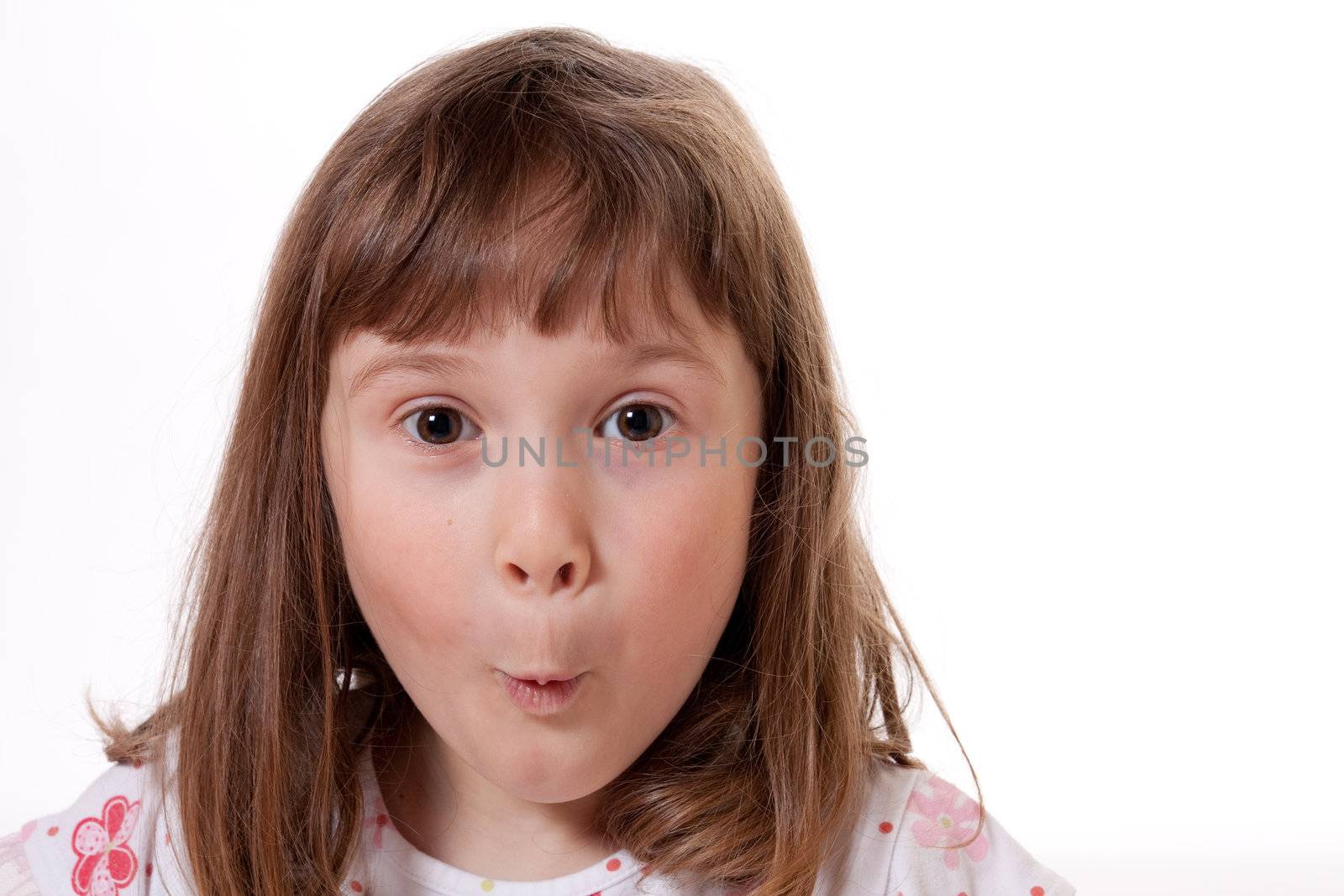 Little girl with a surprised expression