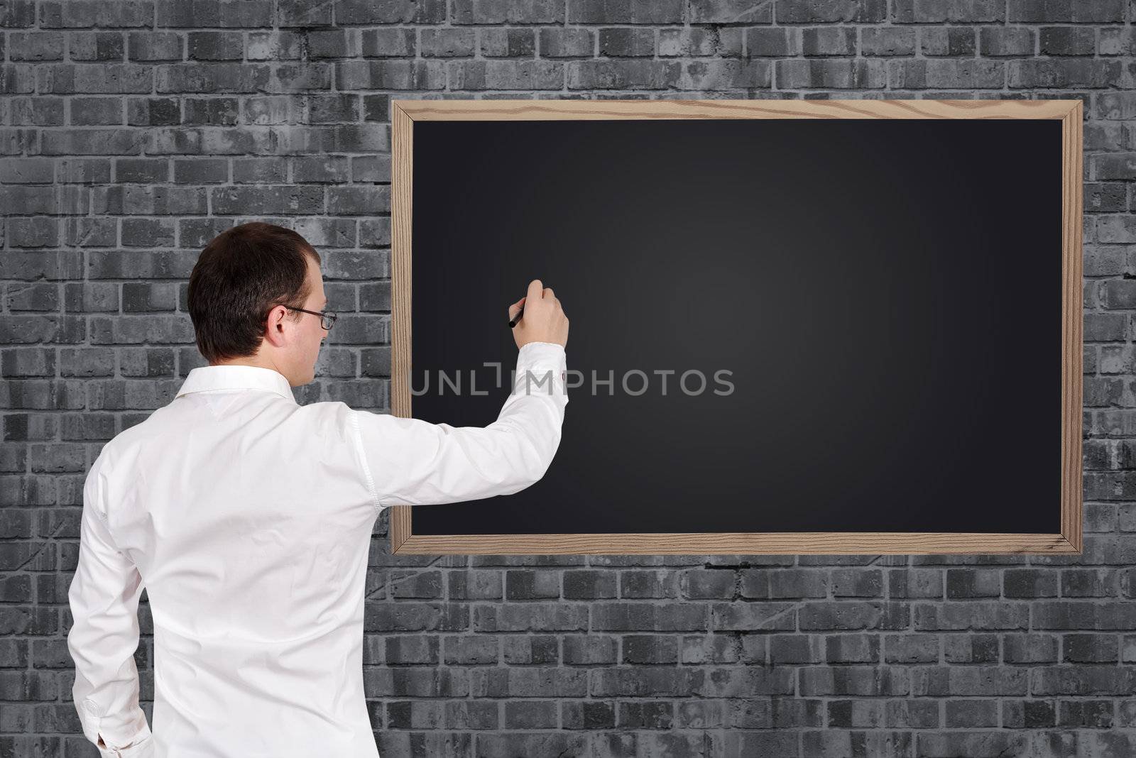 businessman drawing blank on blackboard