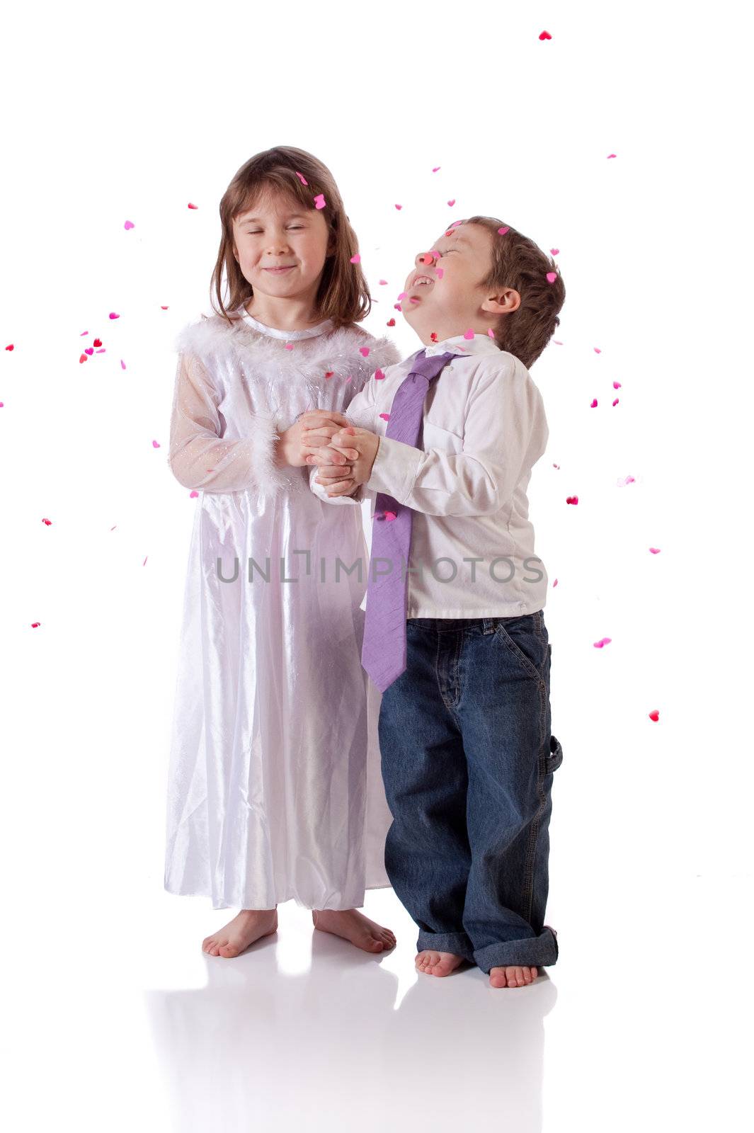 Cute little boy and girl wishing to get married