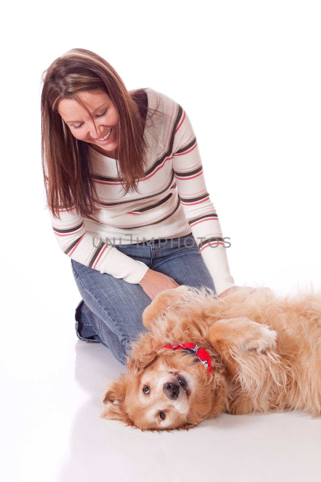 Cute young woman with her purebred Golden Retriever