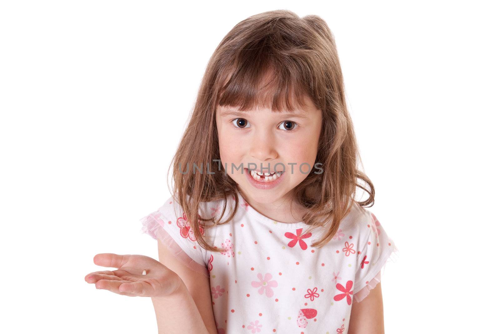 Cute little girl showing the first tooth she lost