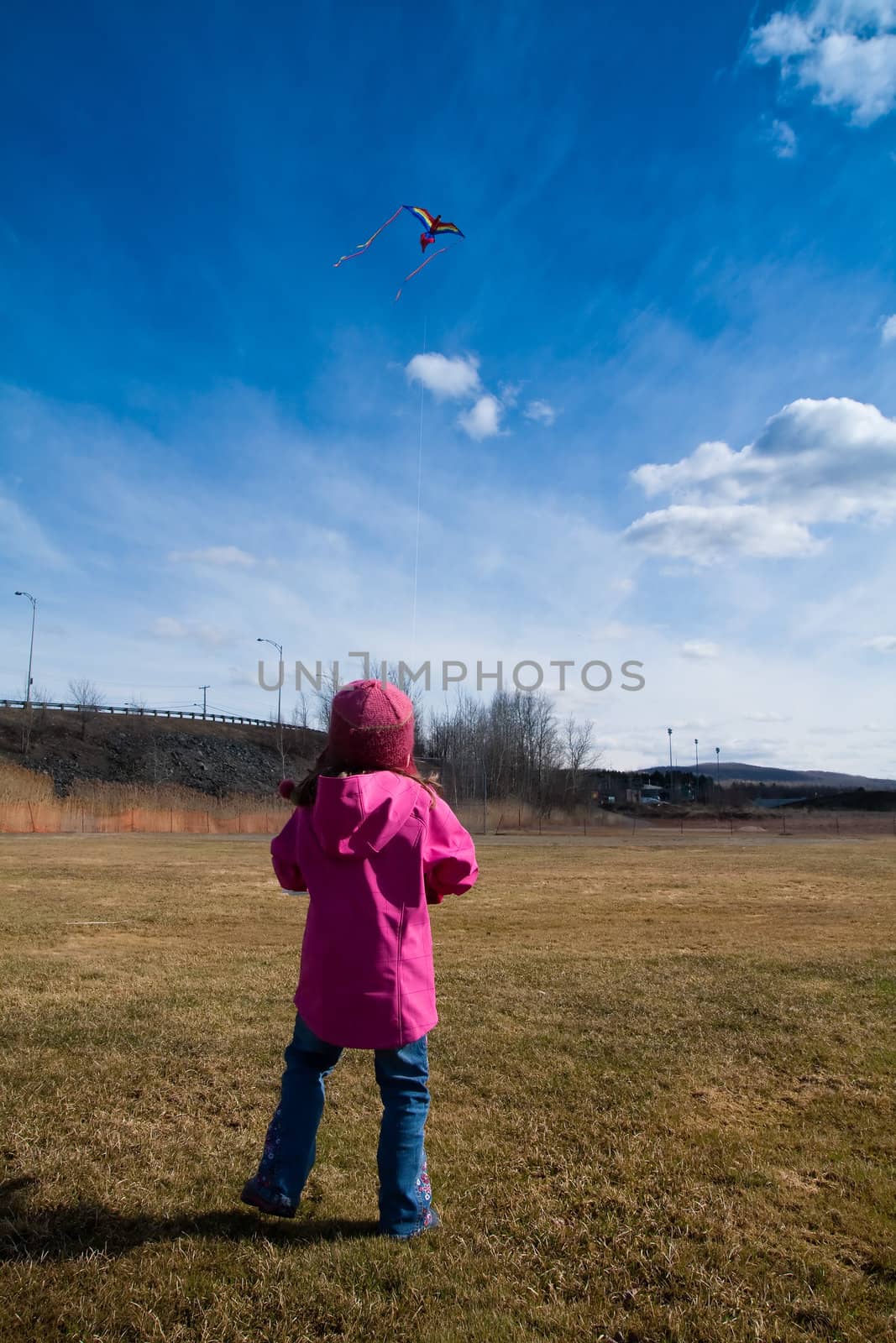 Girl playing with a kite by Talanis