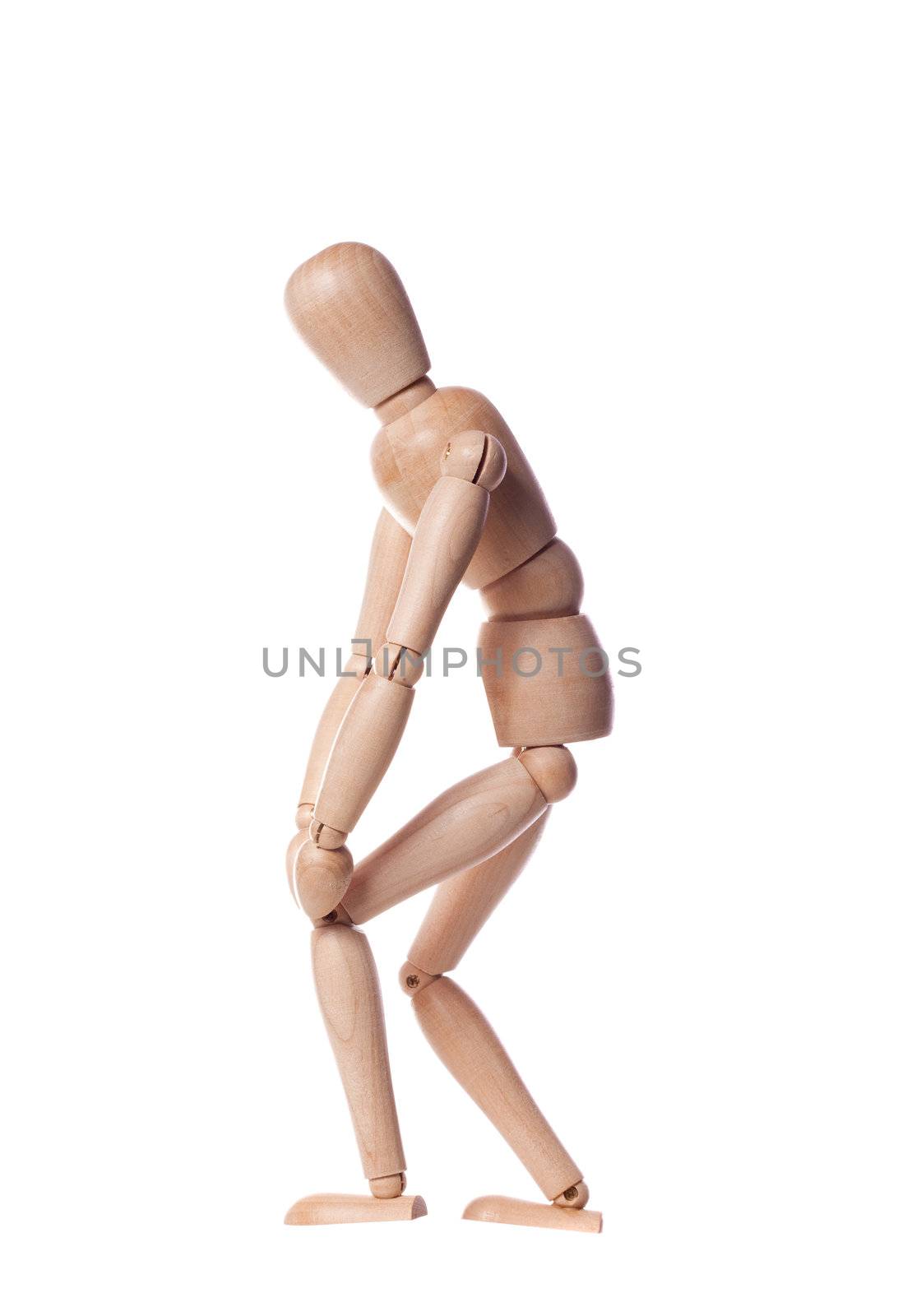 Wooden puppet with knee pain