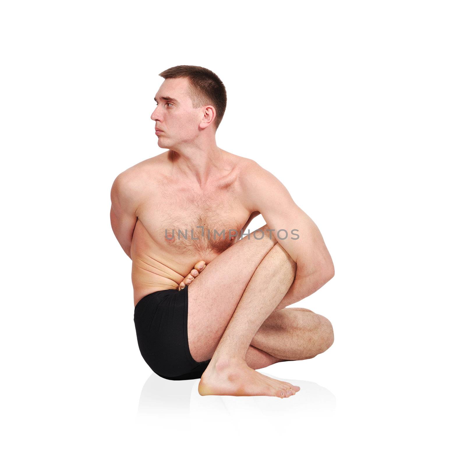handsome bare chested man doing yoga