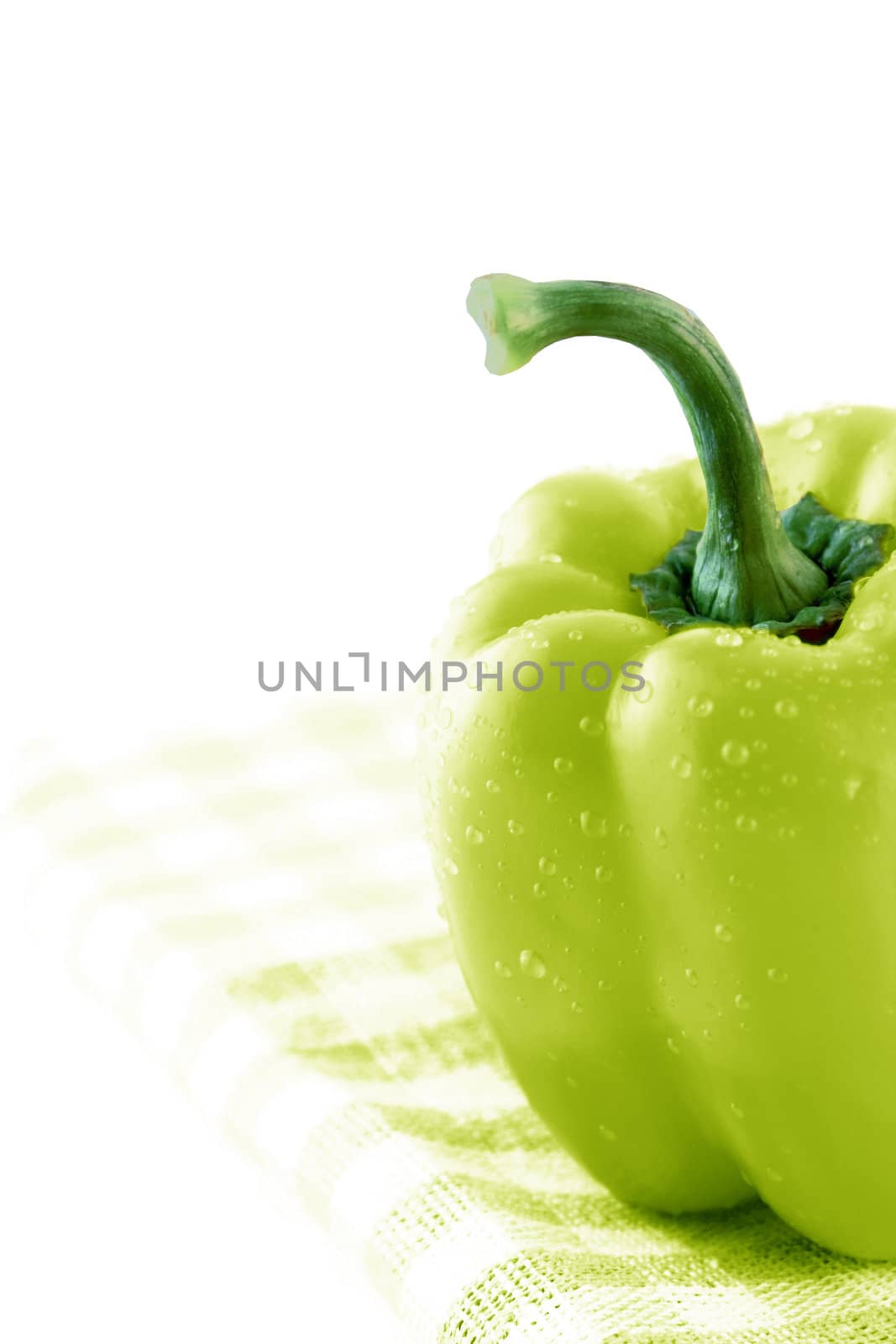 Green sweet bell pepper on Green Napkin.