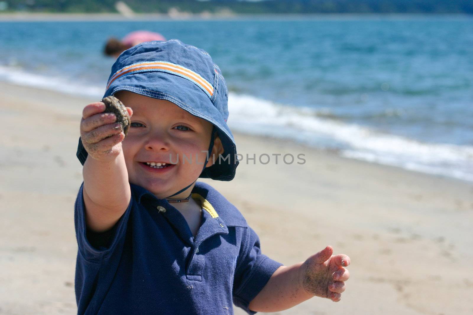 Cute little boy playing on the beach