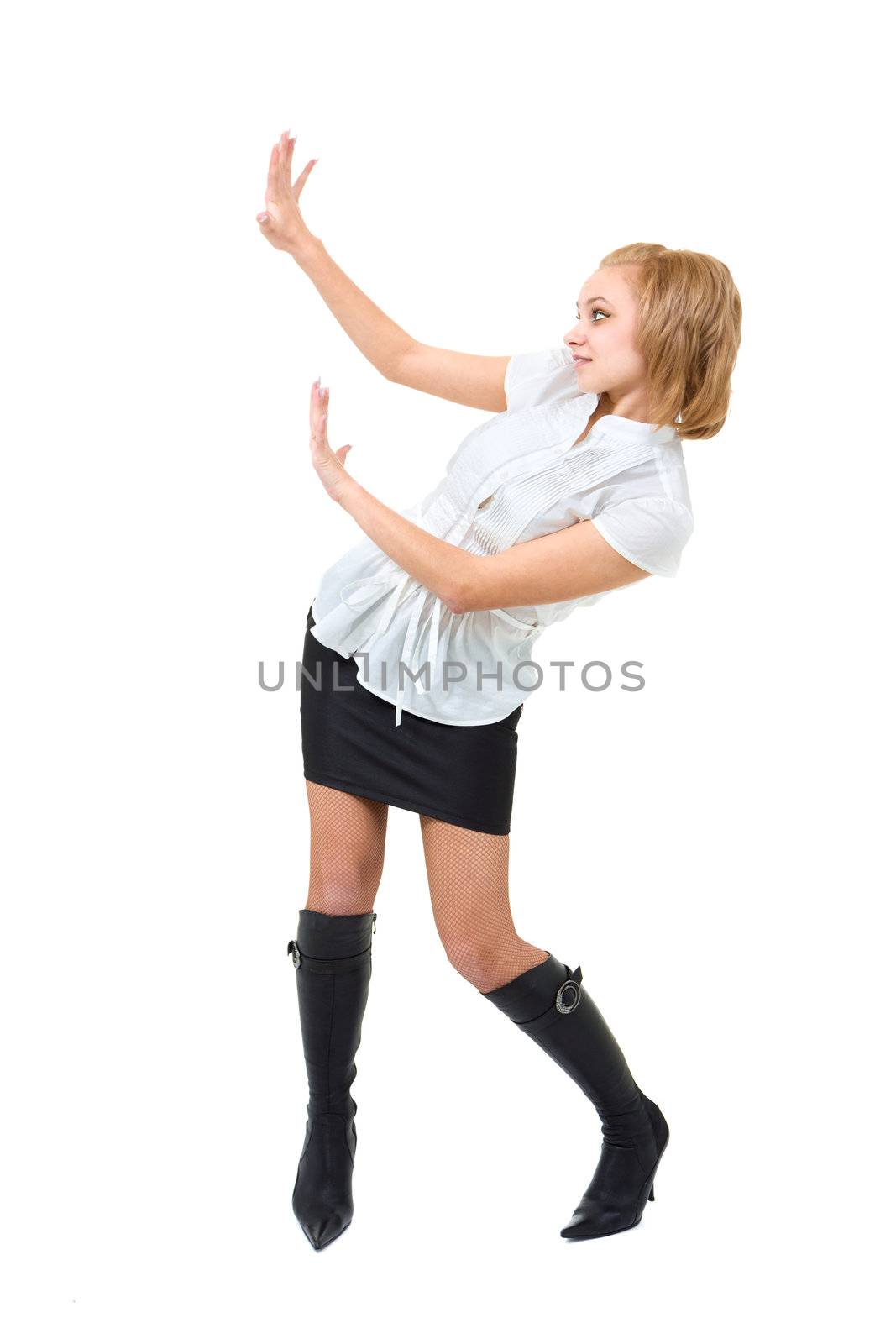 Young woman is holding something abstract above her head. Happy girl with raised hands. Isolated on white background.