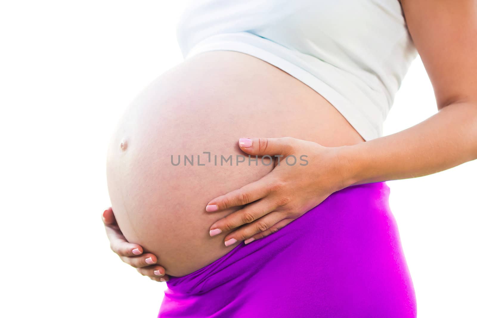 Pregnant woman holding belly with arms 9 month 
