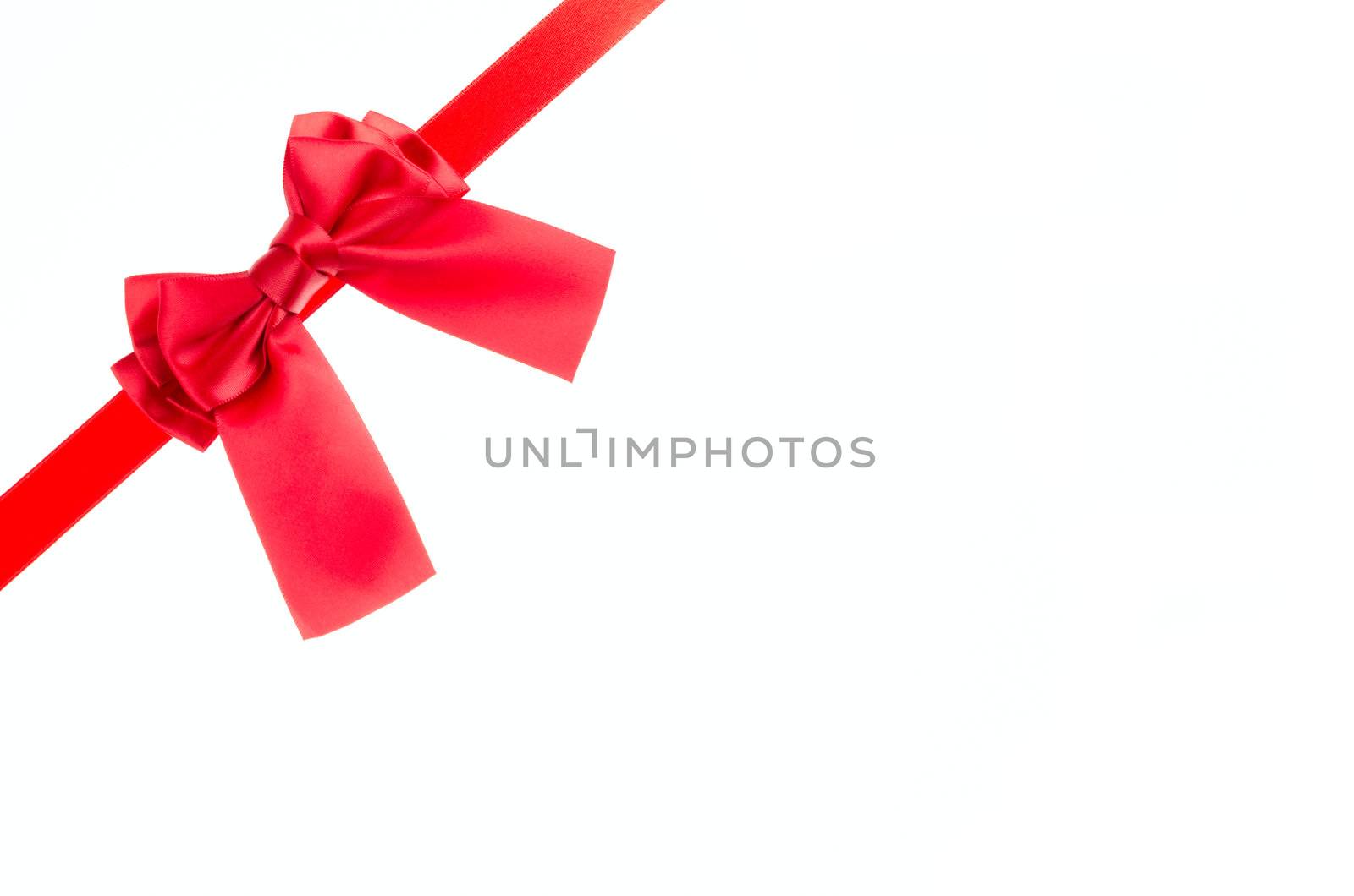 Red ribbon bow isolated on white background.