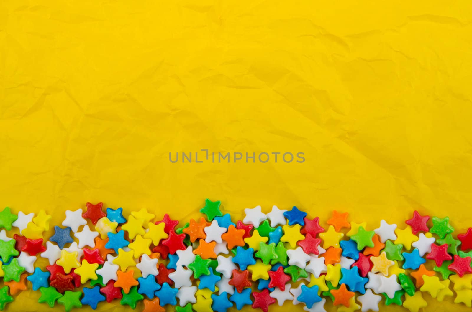 Multicolored stars on a background of crumpled paper by velislava