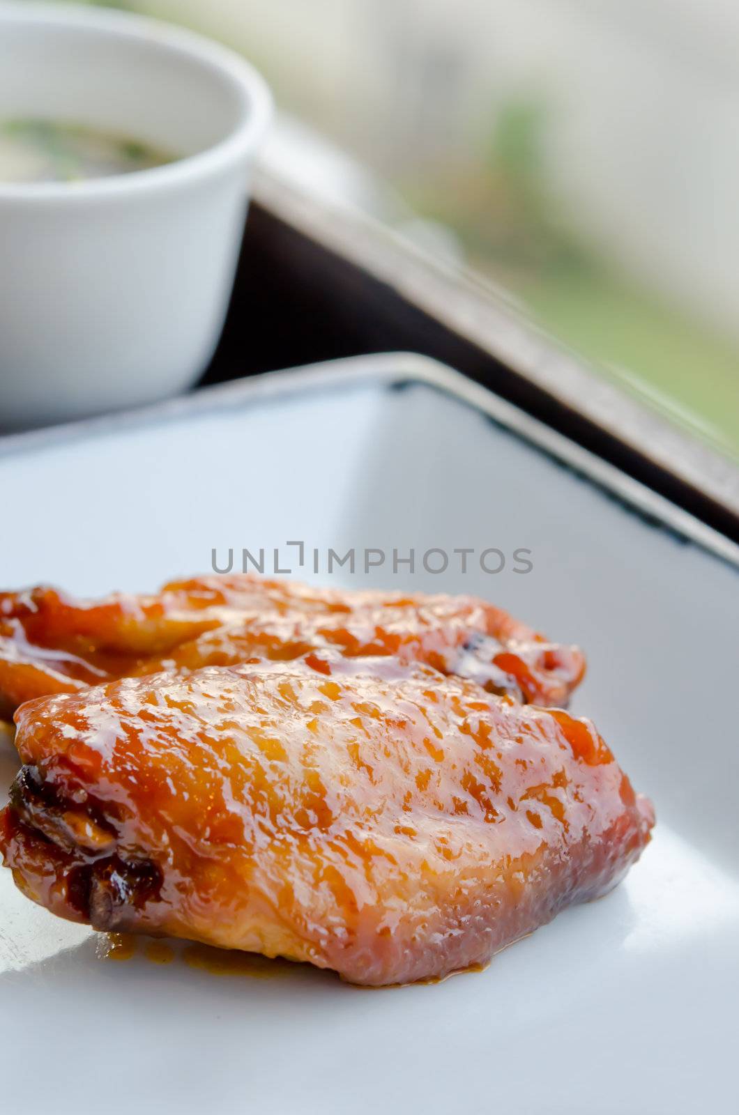 Fried Chicken Wings with sweet sauce  on dish