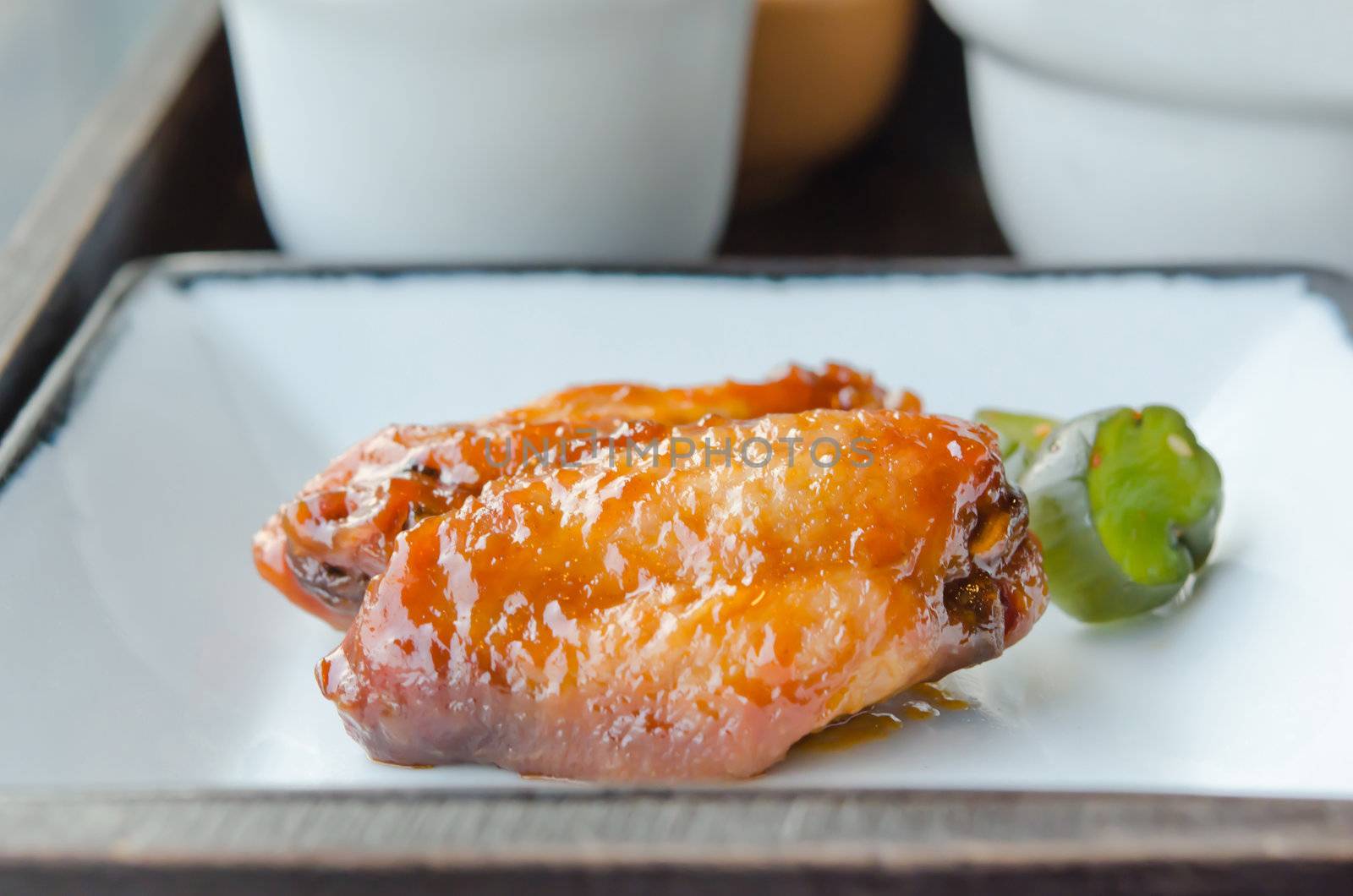 buffalo chicken wings with sweet sauce and  pickled  vegetable