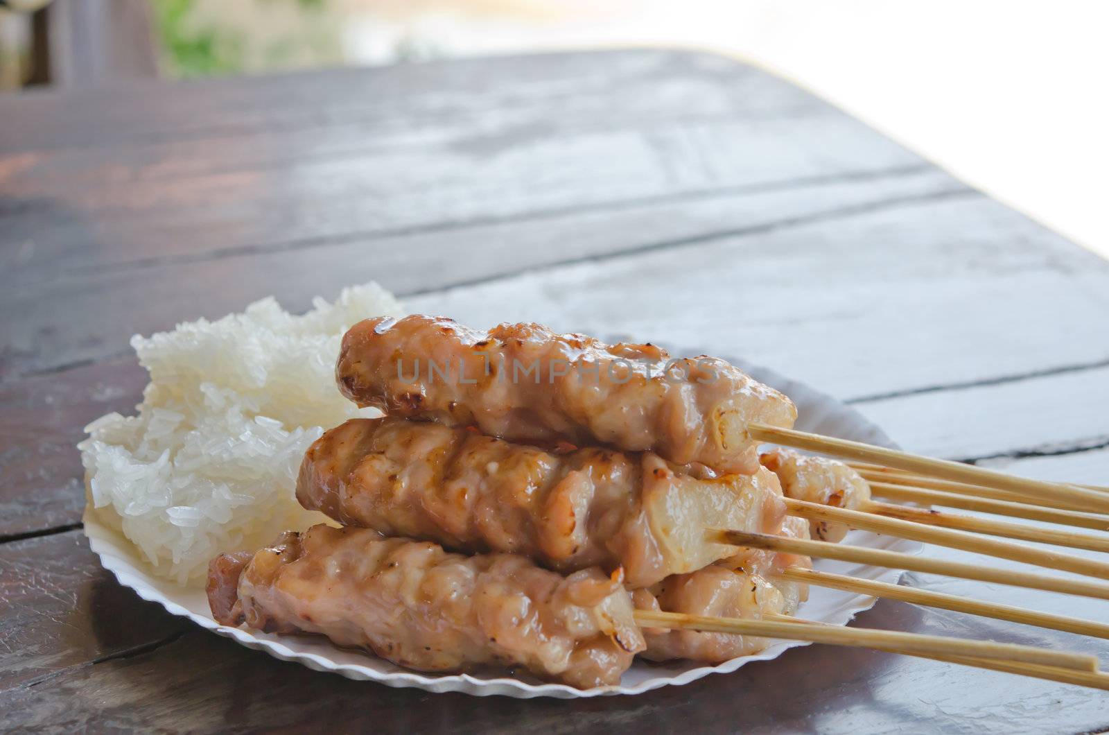 grilled pork with sweet sauce served with sticky rice