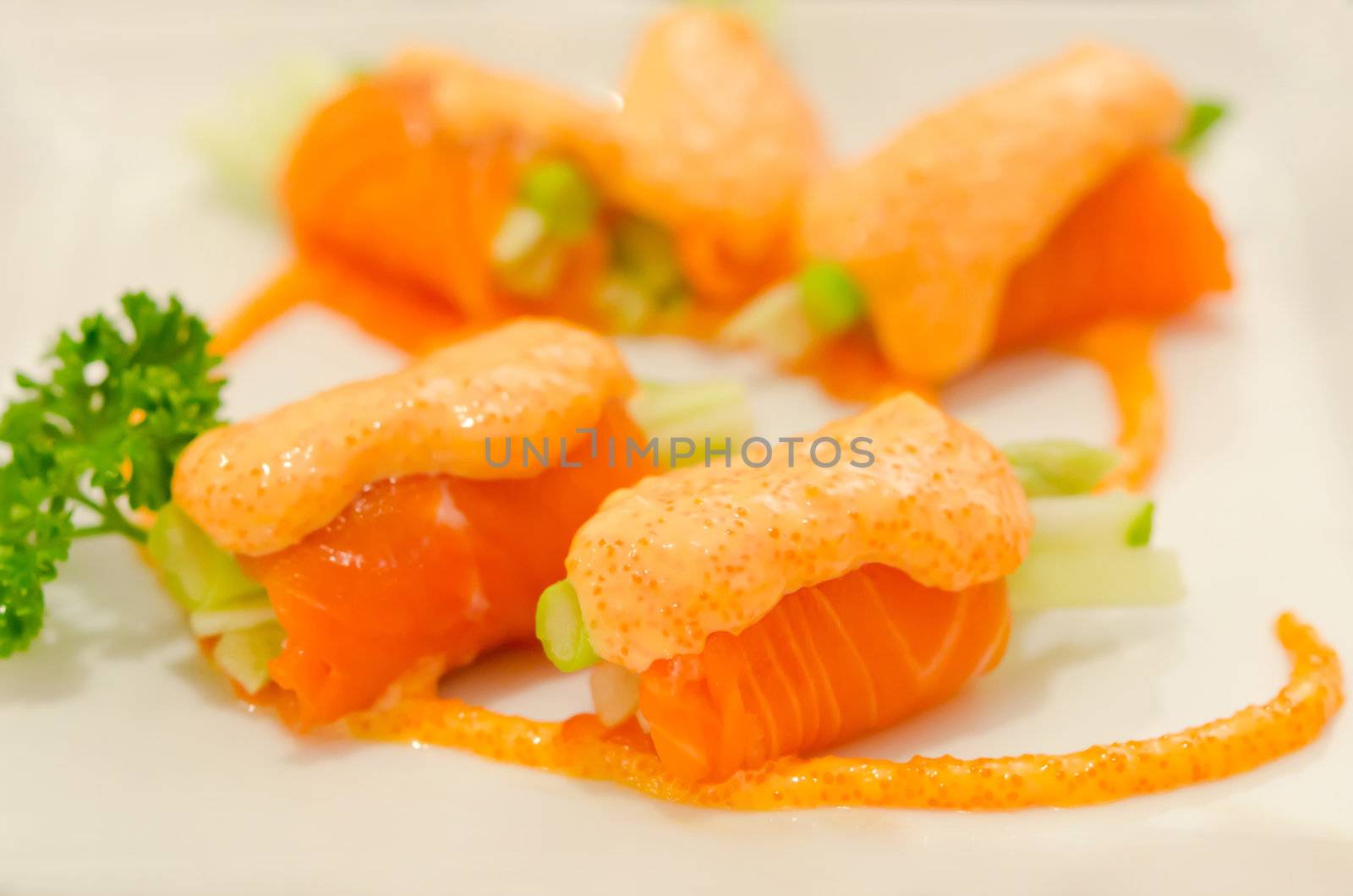 salmon rolls with vegetable on  plate  , seafood dish