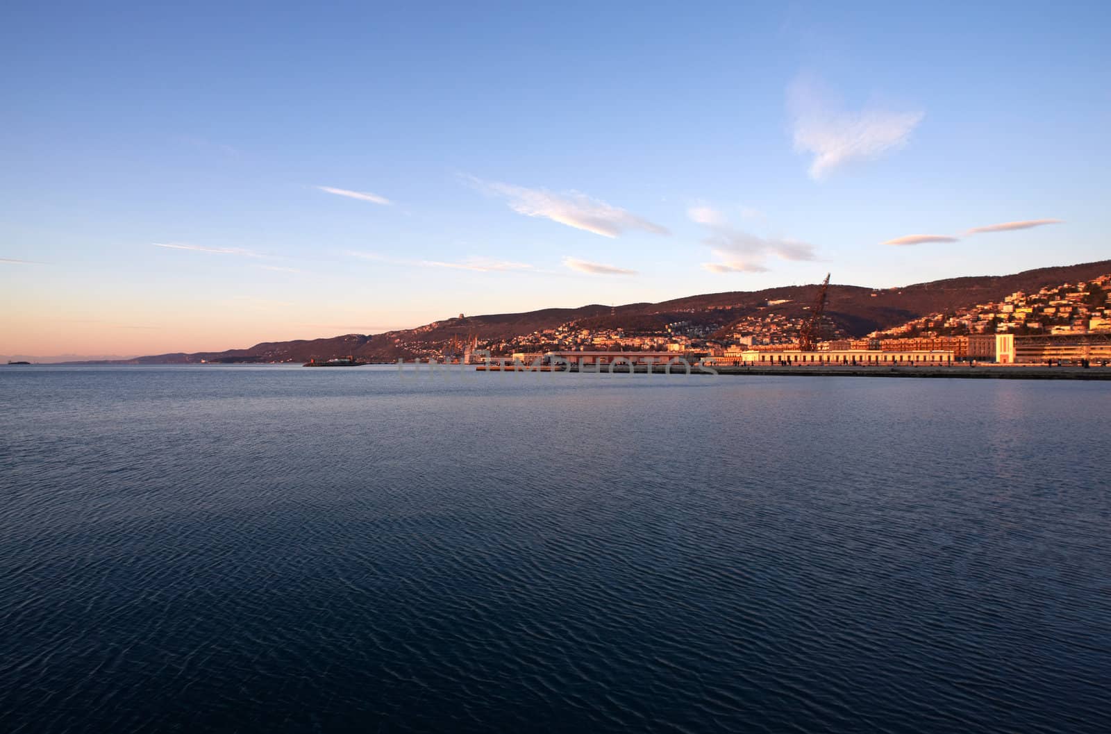 View of Trieste harbor at sunset, Italy