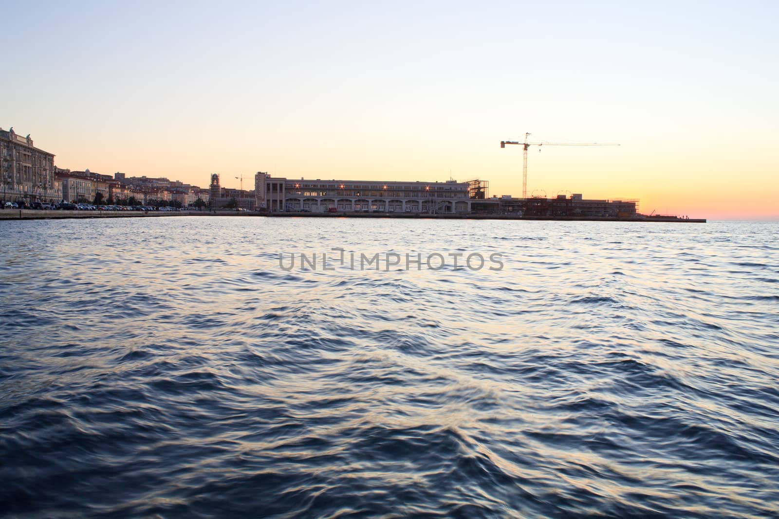 View of Trieste harbor at sunset, Italy