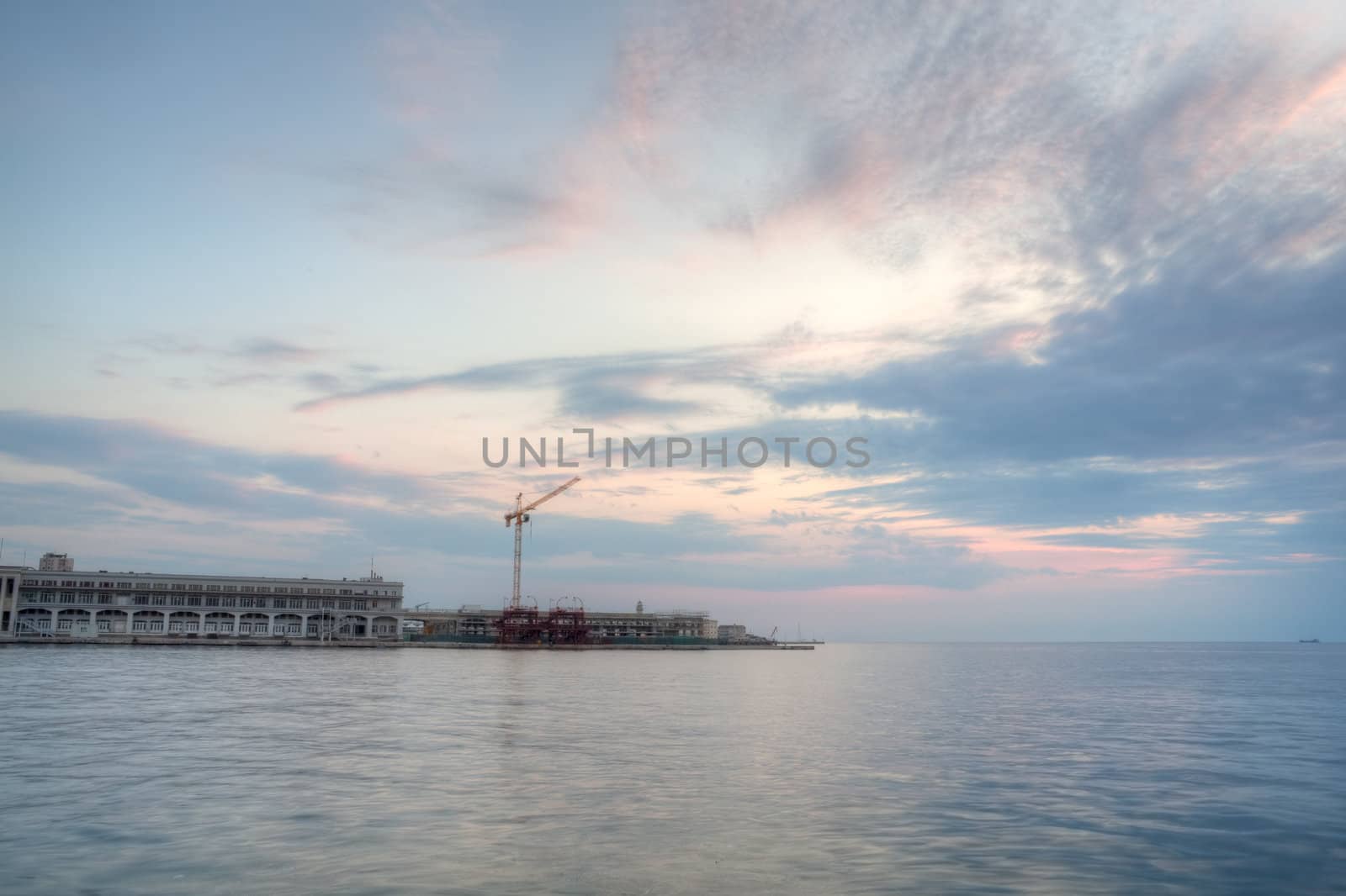 View of Trieste harbor at sunset, Italy