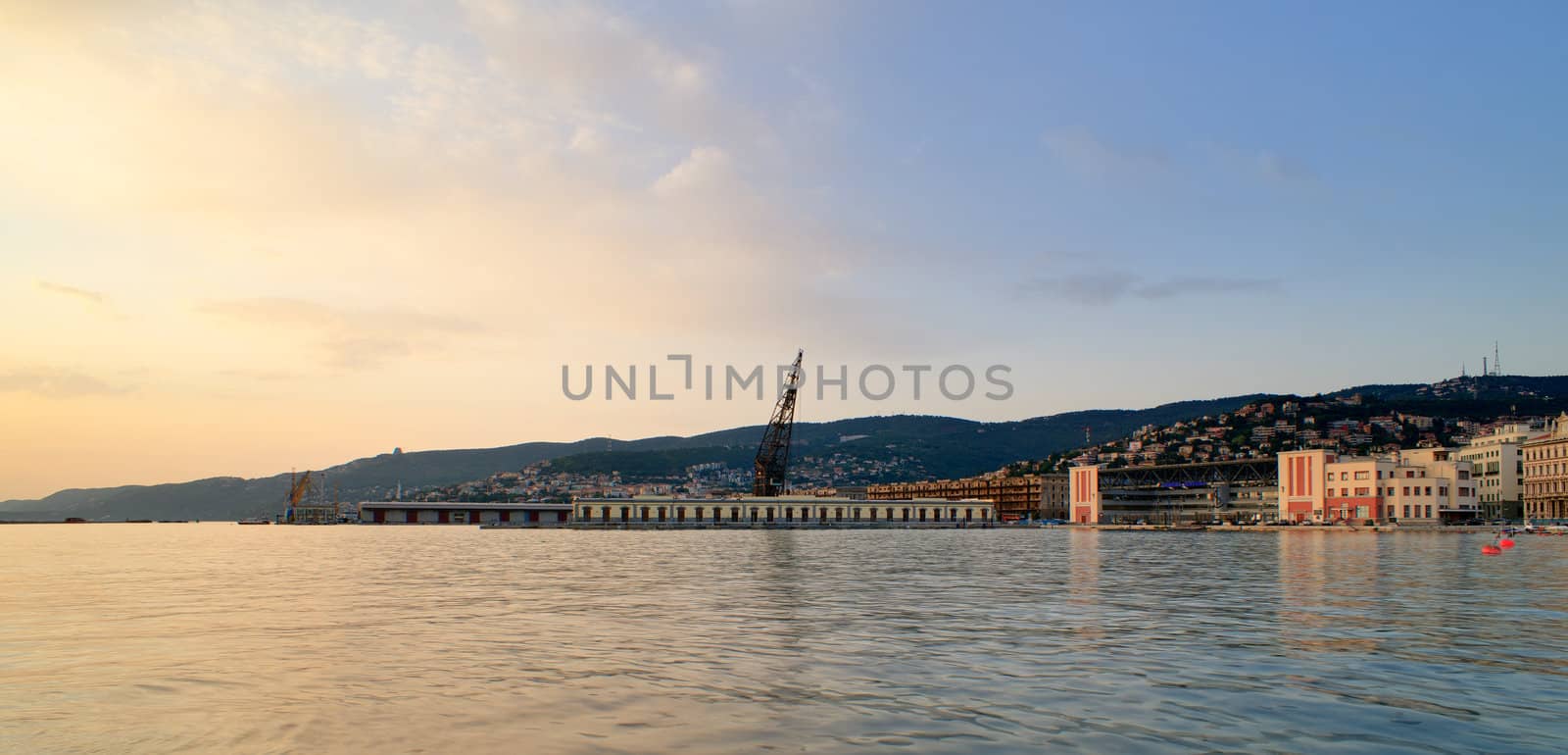 View of Trieste harbor at sunset, Italy