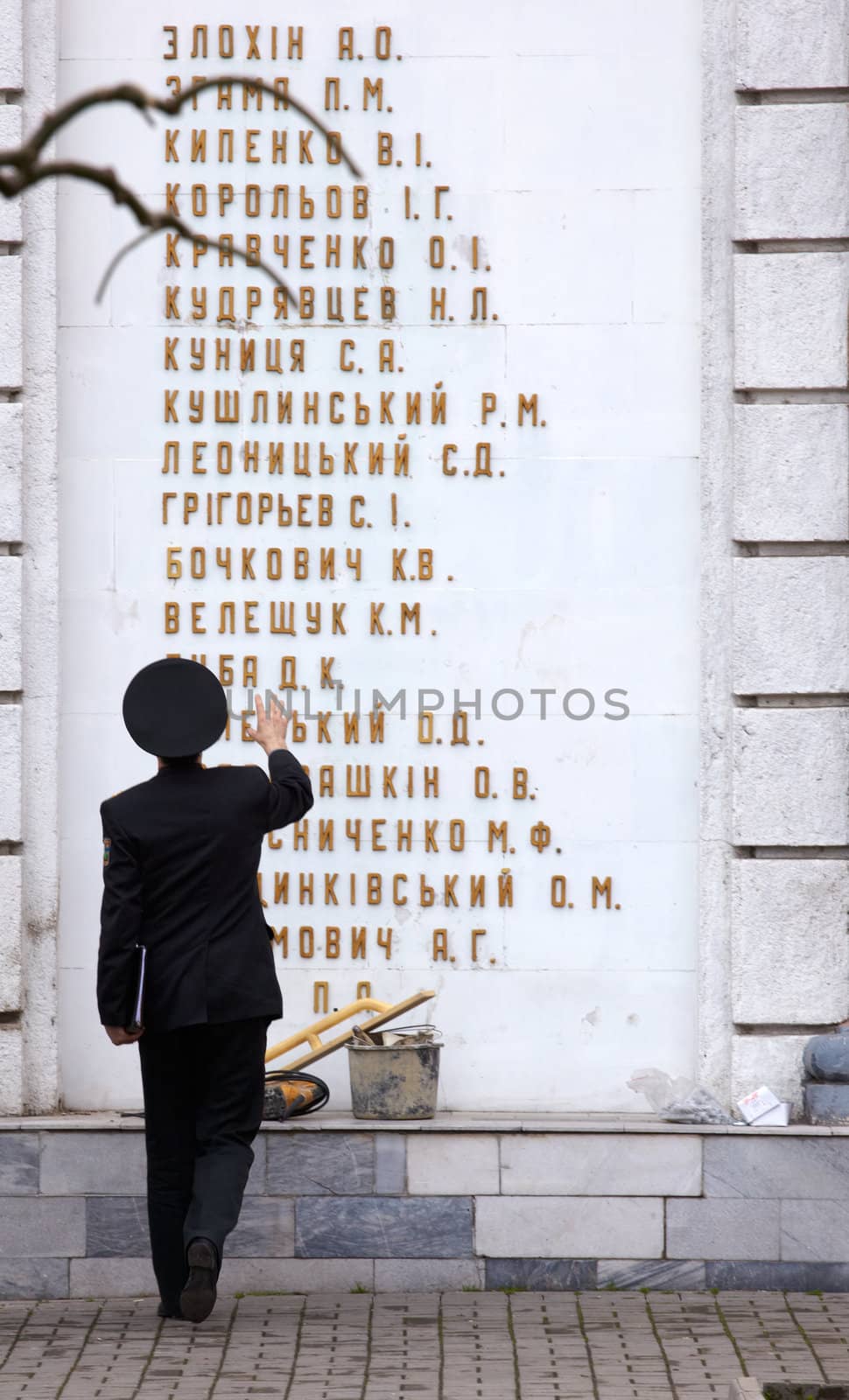 Men in uniform looking the Odessa memorial dedicated to local heroes of the Soviet Union