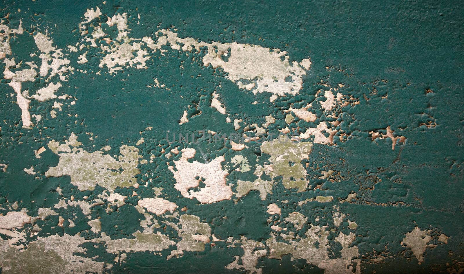 Photo of Cracked green wall