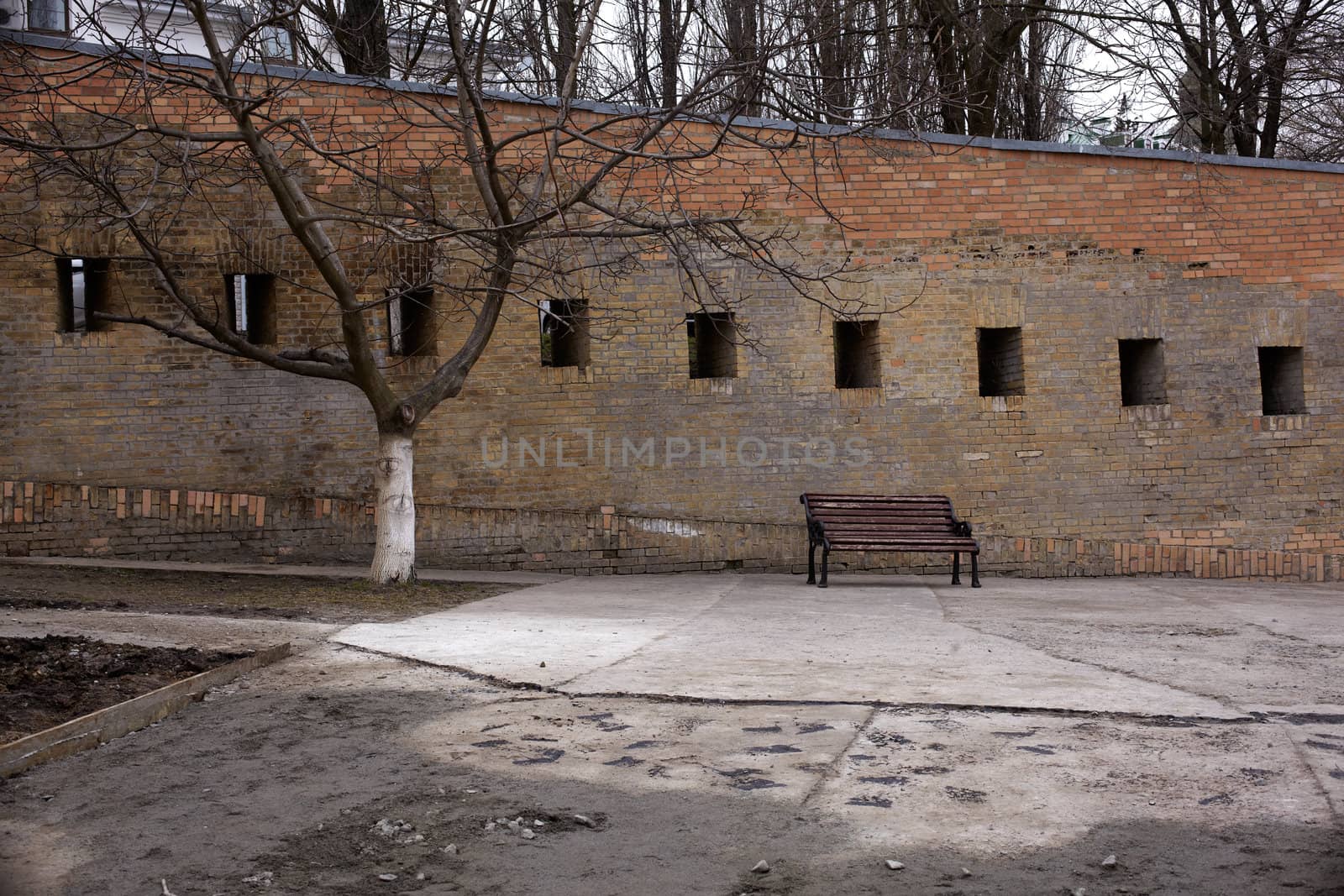 Photo of a Bench next to the wall