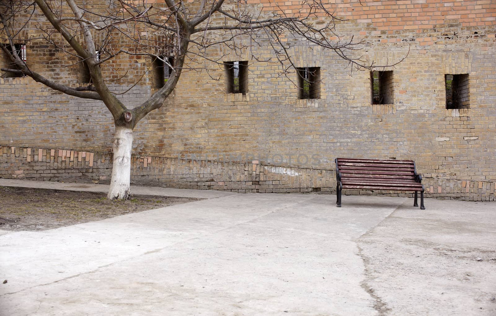 Photo of a Bench next to the wall