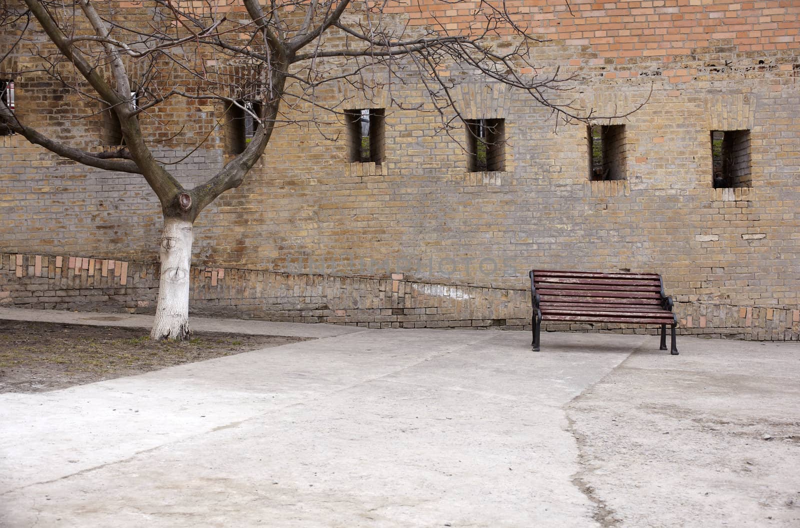 Photo of a Bench next to the wall