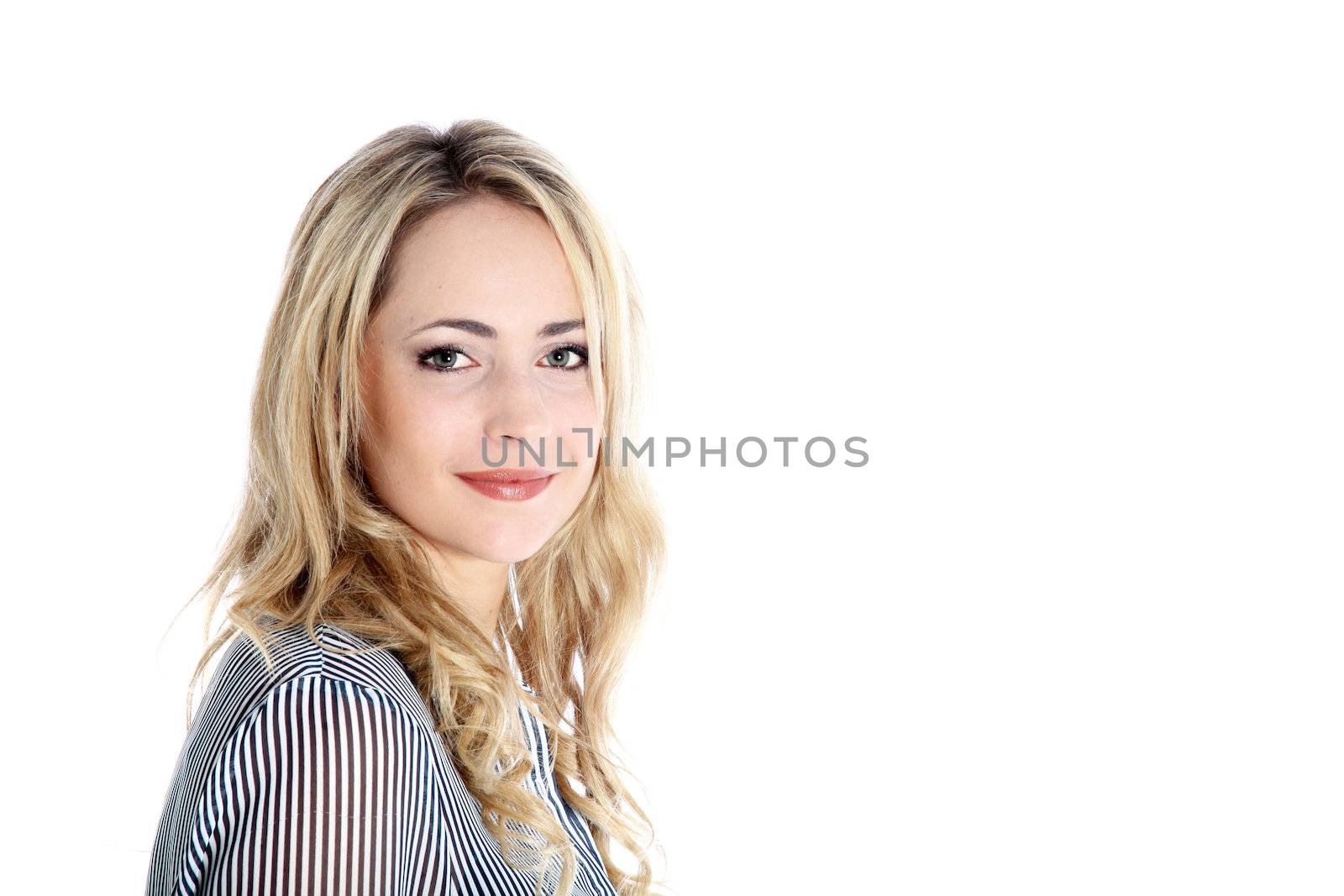 Head and shoulders portrait o a beautiful blonde woman standing sideways facing the camera with large white copyspace 