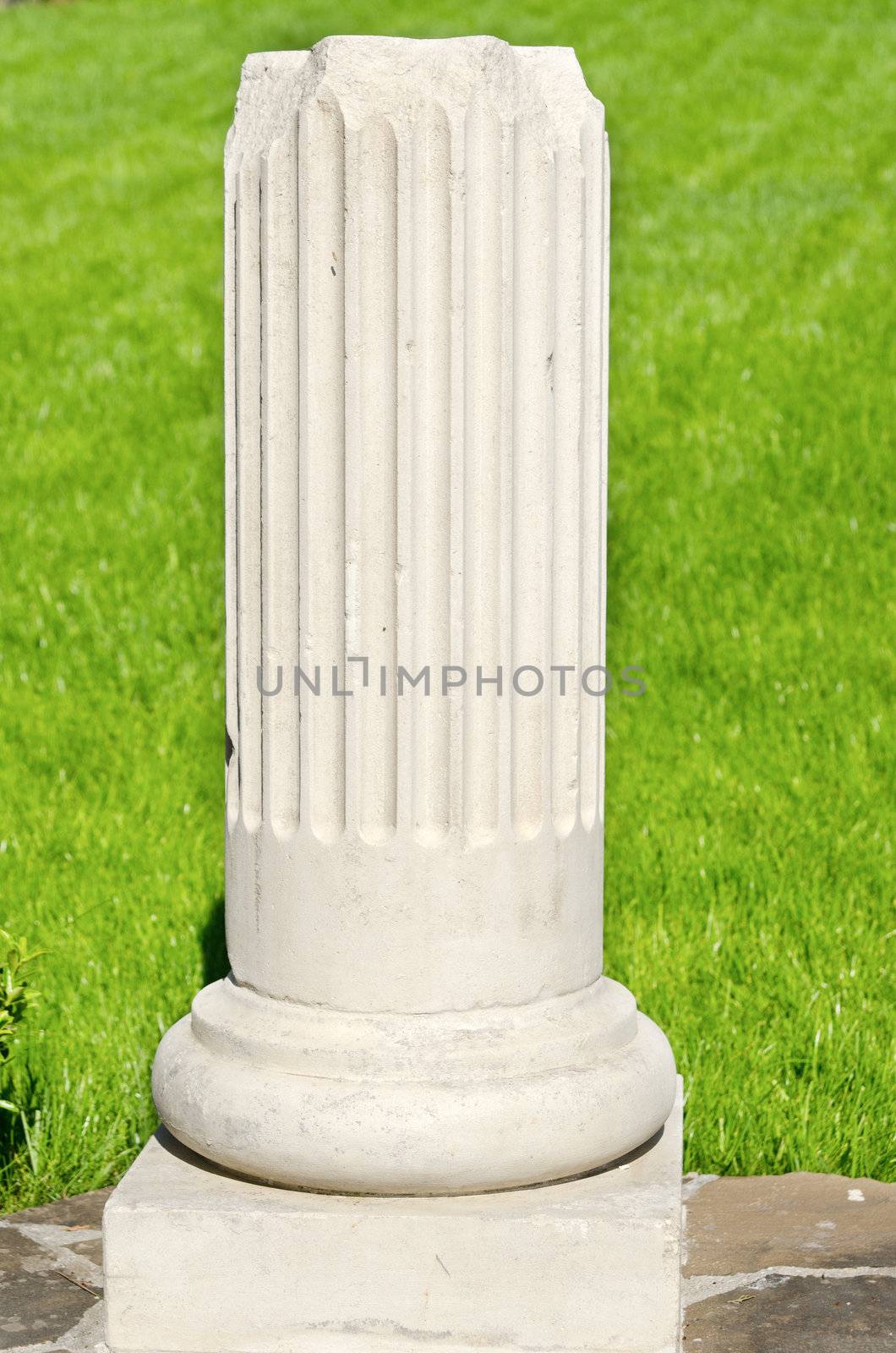 bottom of white ionic column by mycola