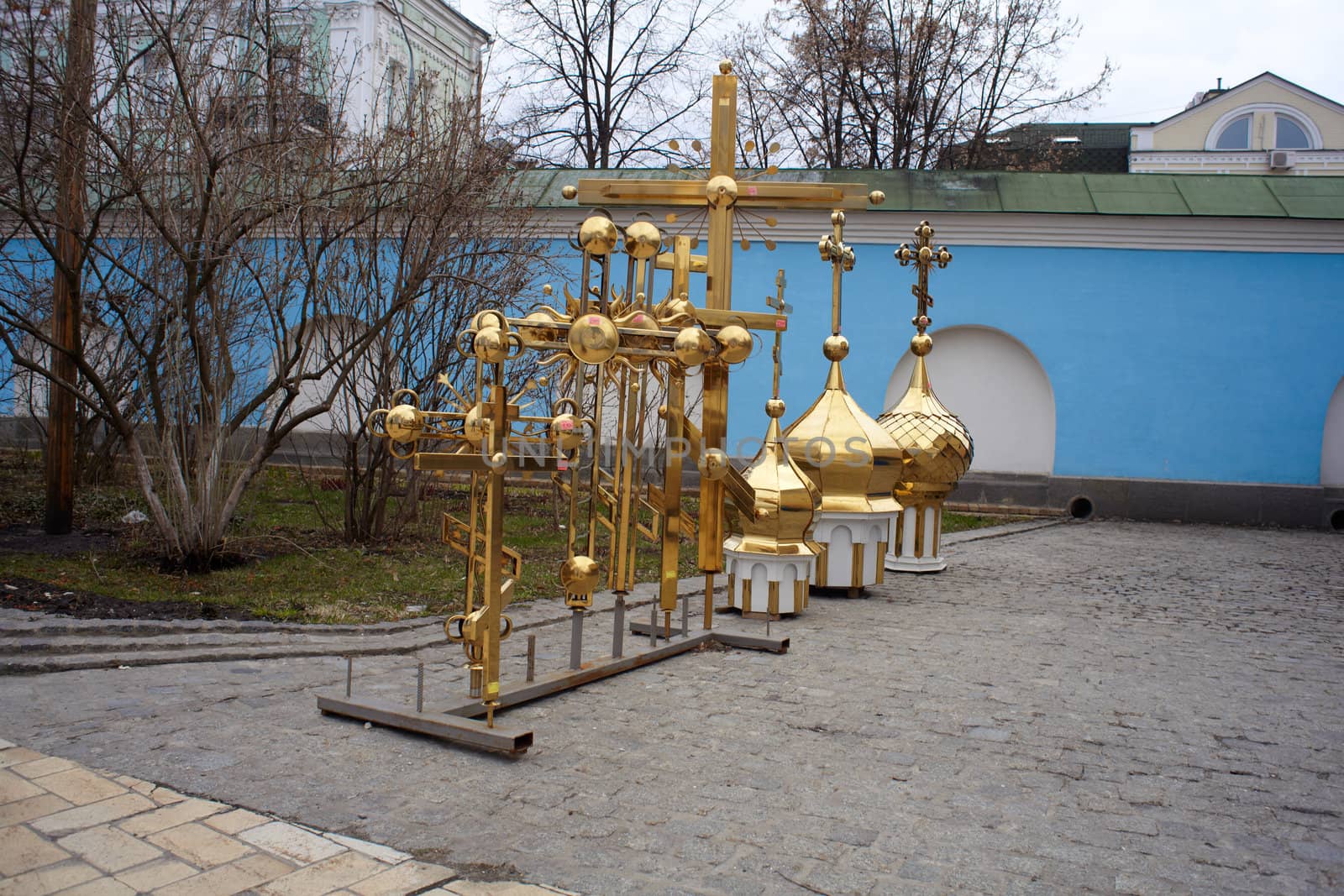 Gold cupolas and orthodox cross, St. Michael monastery in Kiev