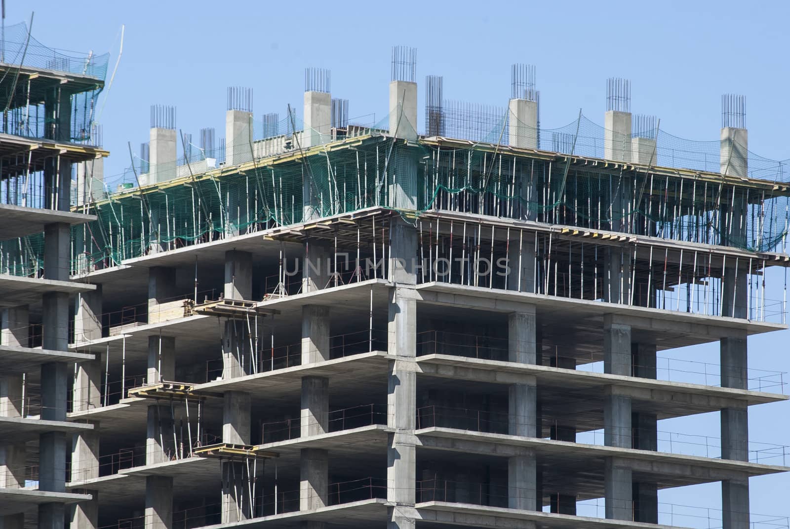 Large building under construction in sunny day